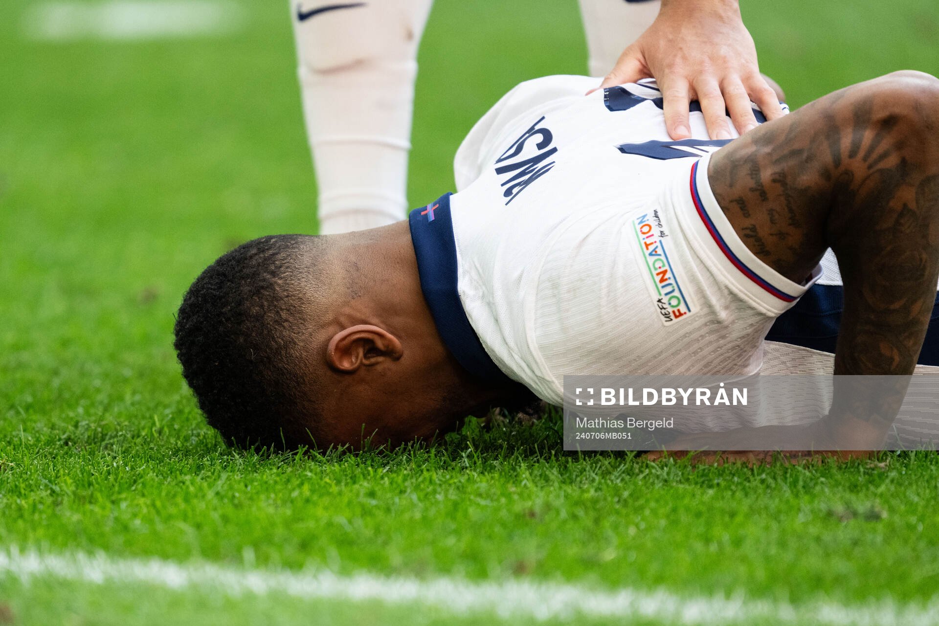 Ezri Konsa of England in pain
