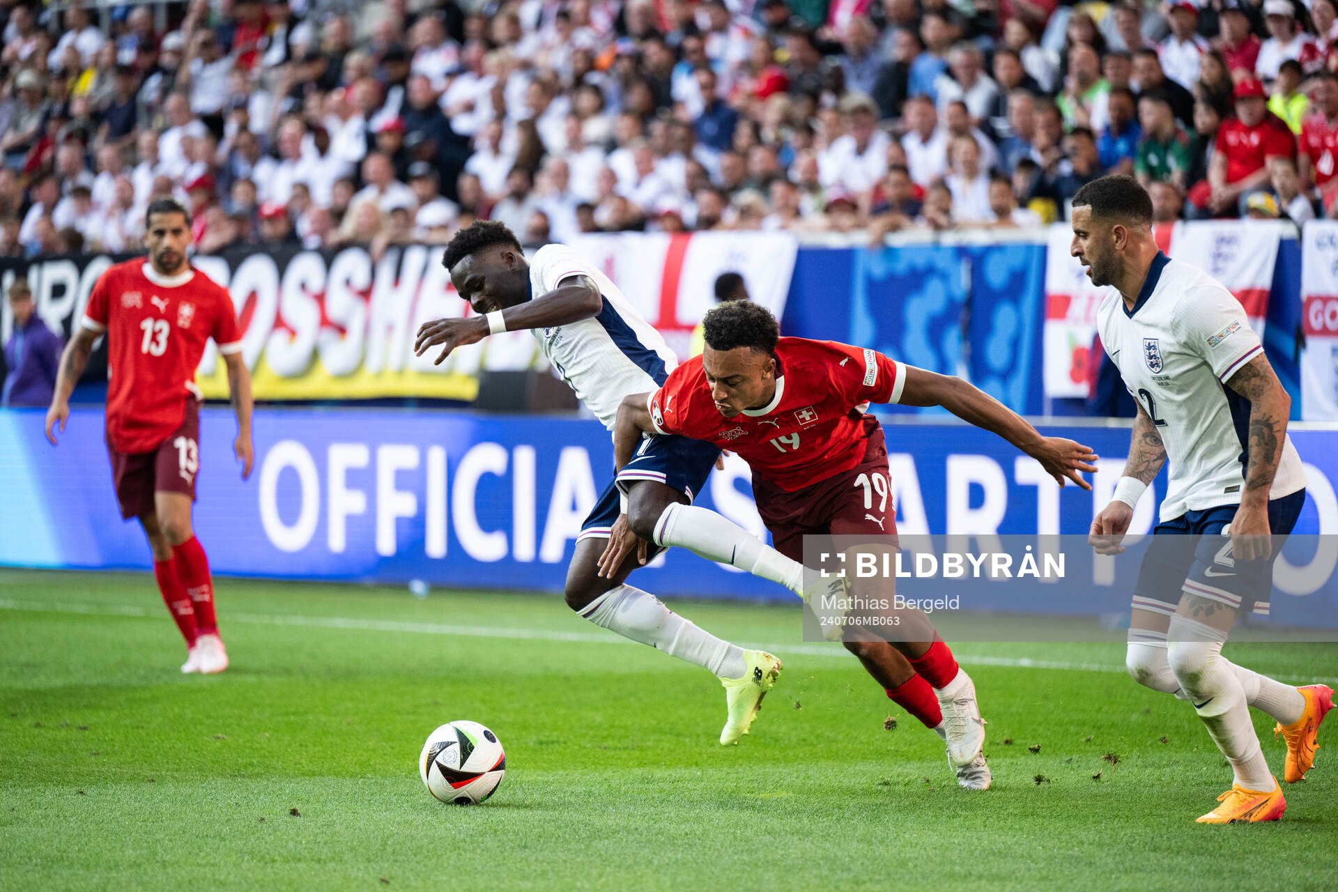 Bukayo Saka of England and Dan Ndoye of Switzerland