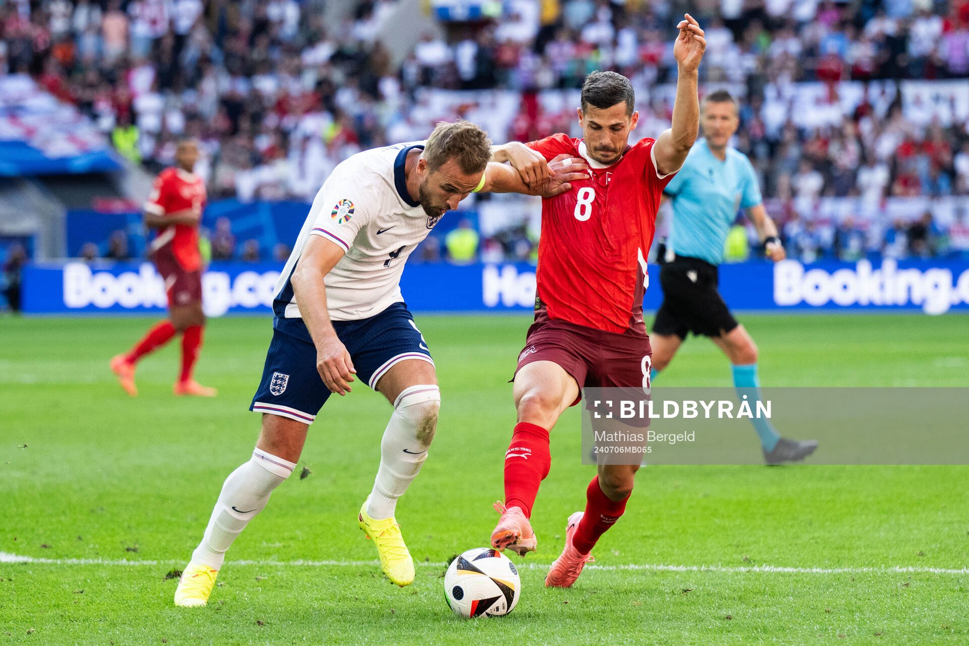 Harry Kane of England and Remo Freuler of Switzerland