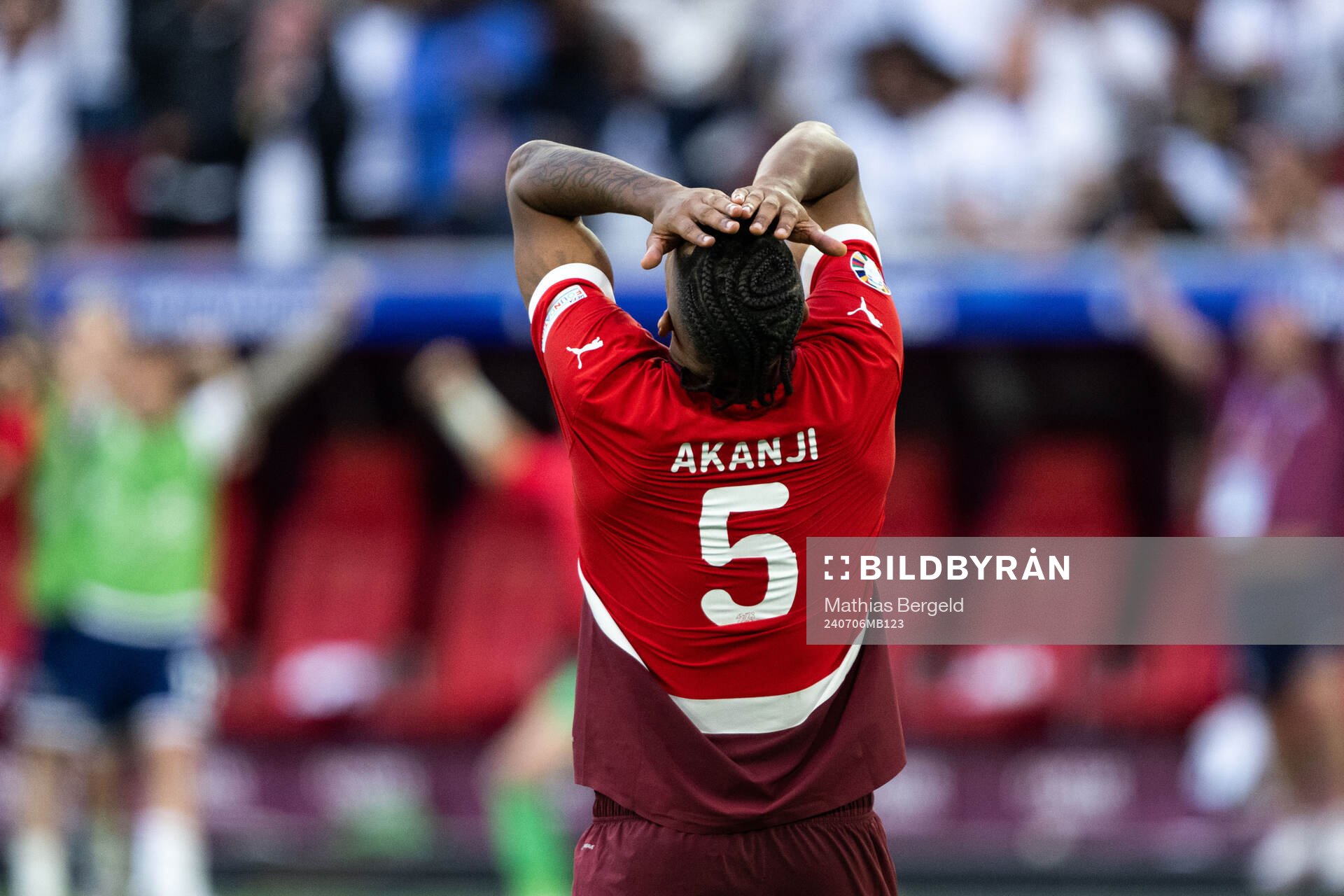 Manuel Akanji of Switzerland looks dejected