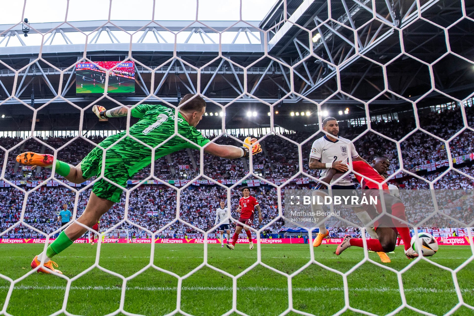 Goalkeeper Jordan Pickford and Kyle Walker see Breel Embolo of Switzerland score 0-1 during the UEFA Euro 2024 Football Championship quarterfinal between England and Switzerland on July 6, 2024 in Düsseldorf.