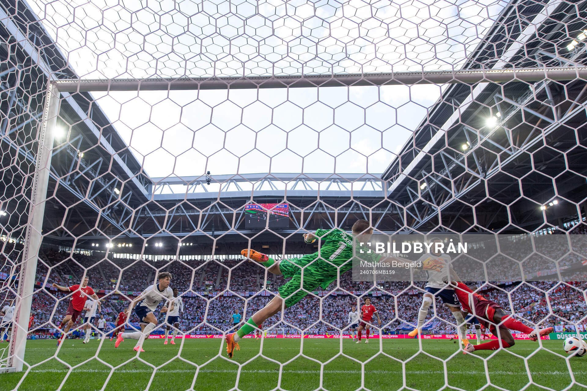Goalkeeper Jordan Pickford and Kyle Walker see Breel Embolo of Switzerland score 0-1 during the UEFA Euro 2024 Football Championship quarterfinal between England and Switzerland on July 6, 2024 in Düsseldorf.