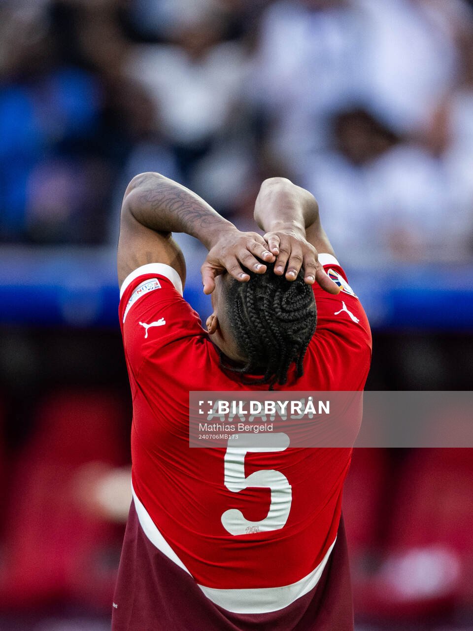 Manuel Akanji of Switzerland looks dejected