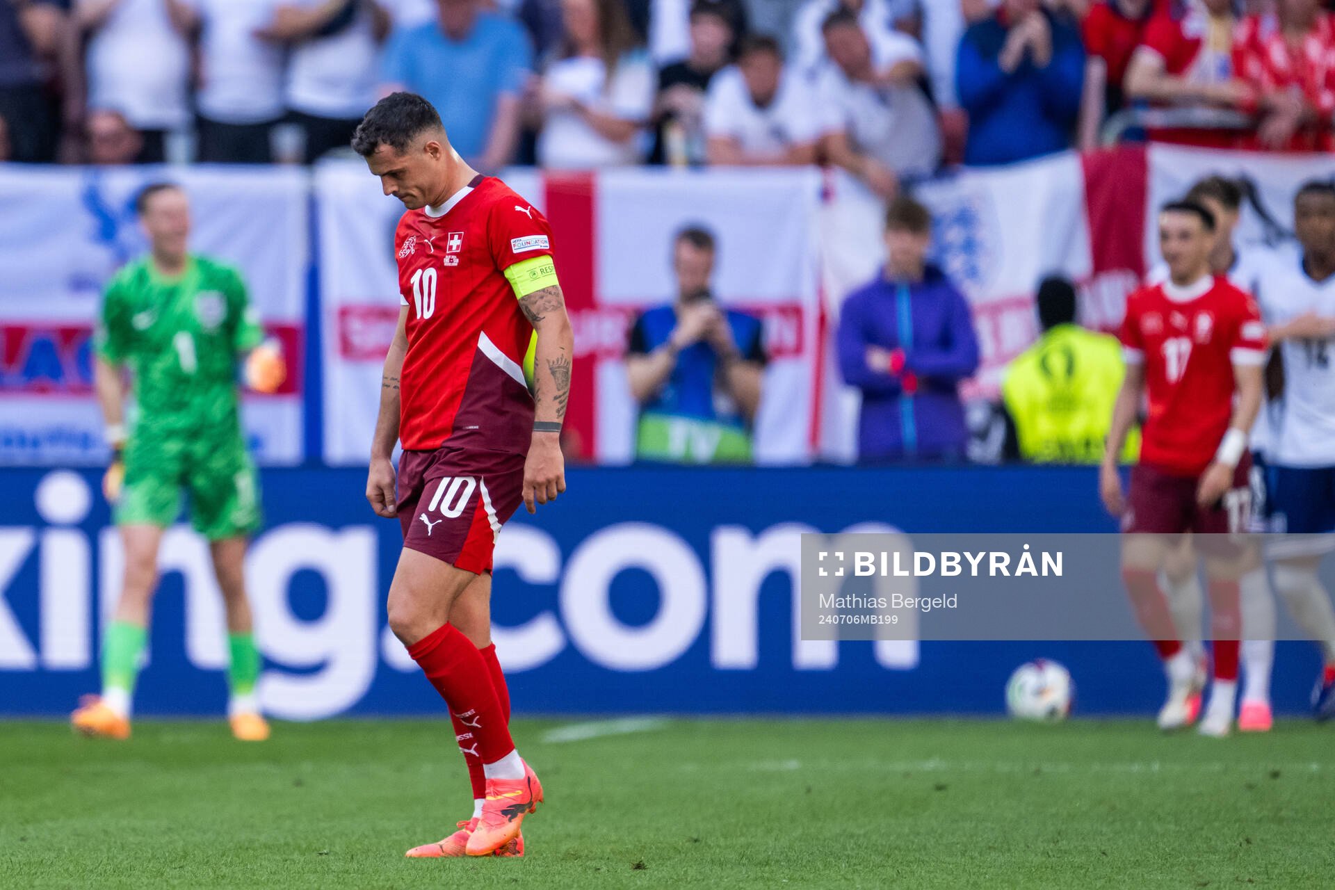 Granit Xhaka of Switzerland looks dejected