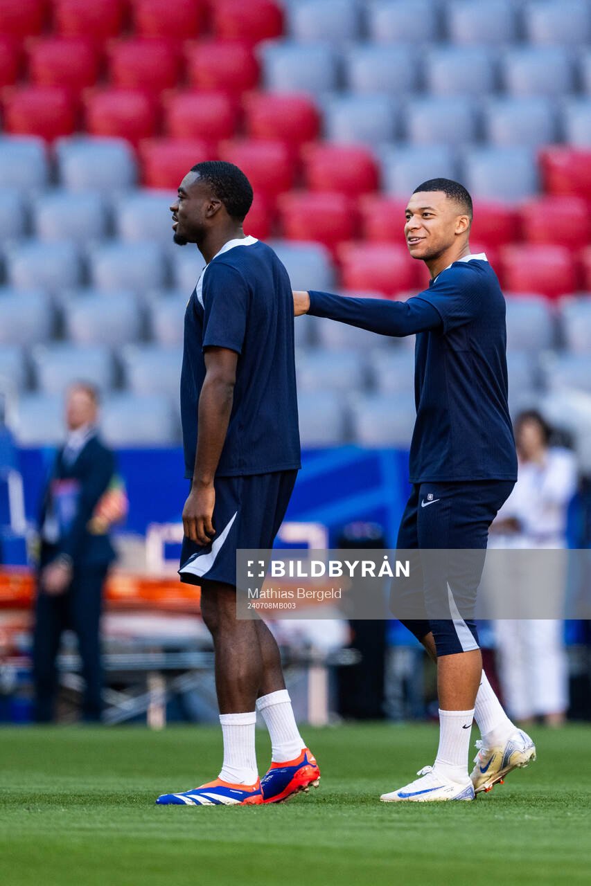Youssouf Fofana and Kylian Mbappé at a training session
