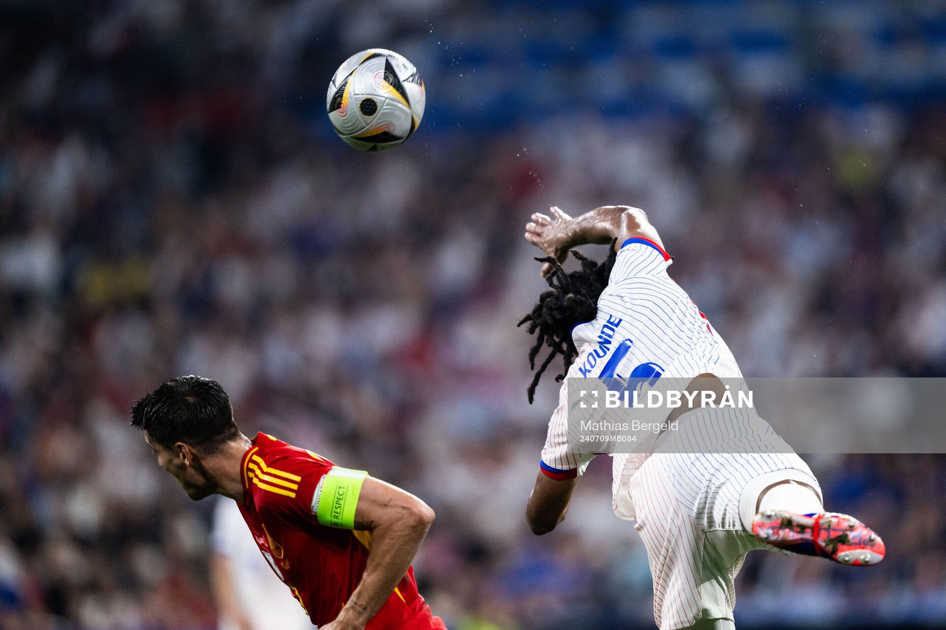 Alvaro Morata of Spain and Jules Koundé of France