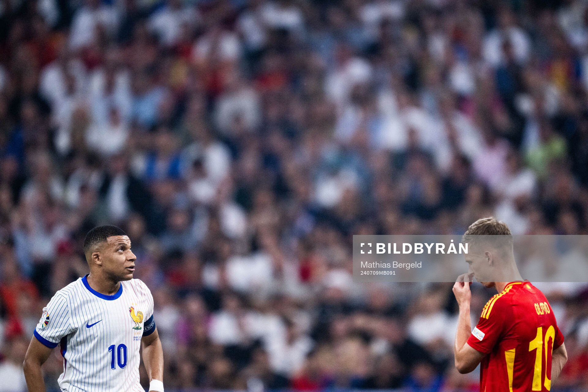 Kylian Mbappé of France and Daniel Olmo of Spain