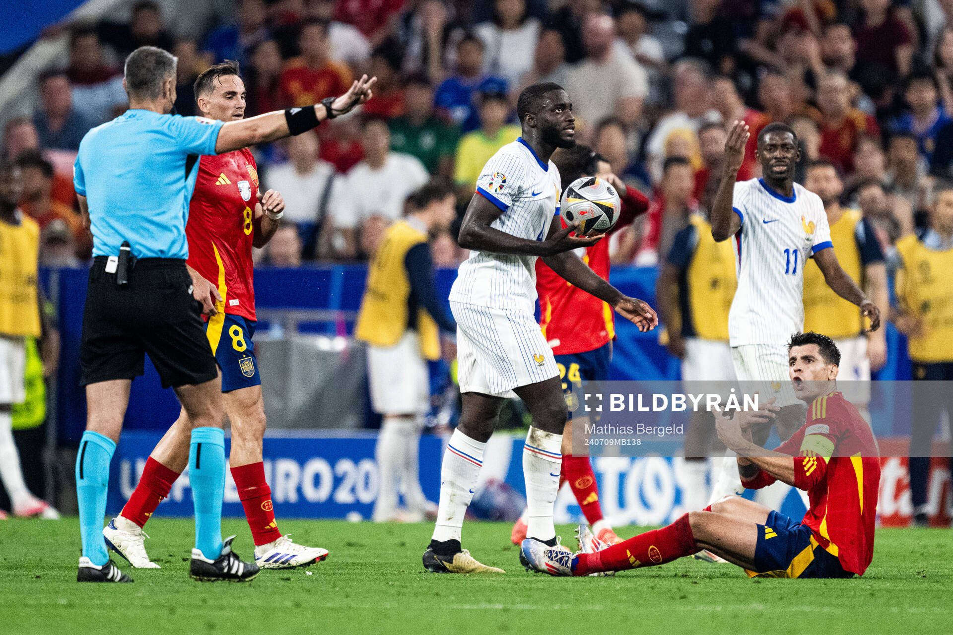 Dayot Upamecano of France and Alvaro Morata of Spain reacts
