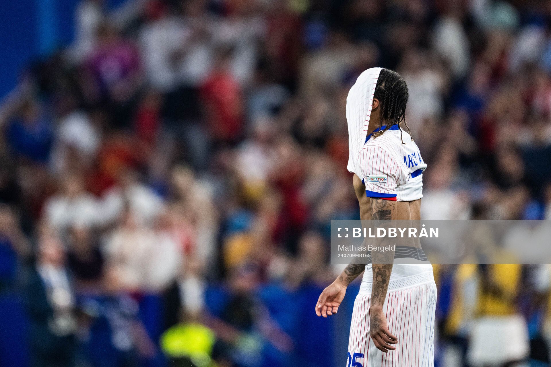Bradley Barcola of France looks dejected