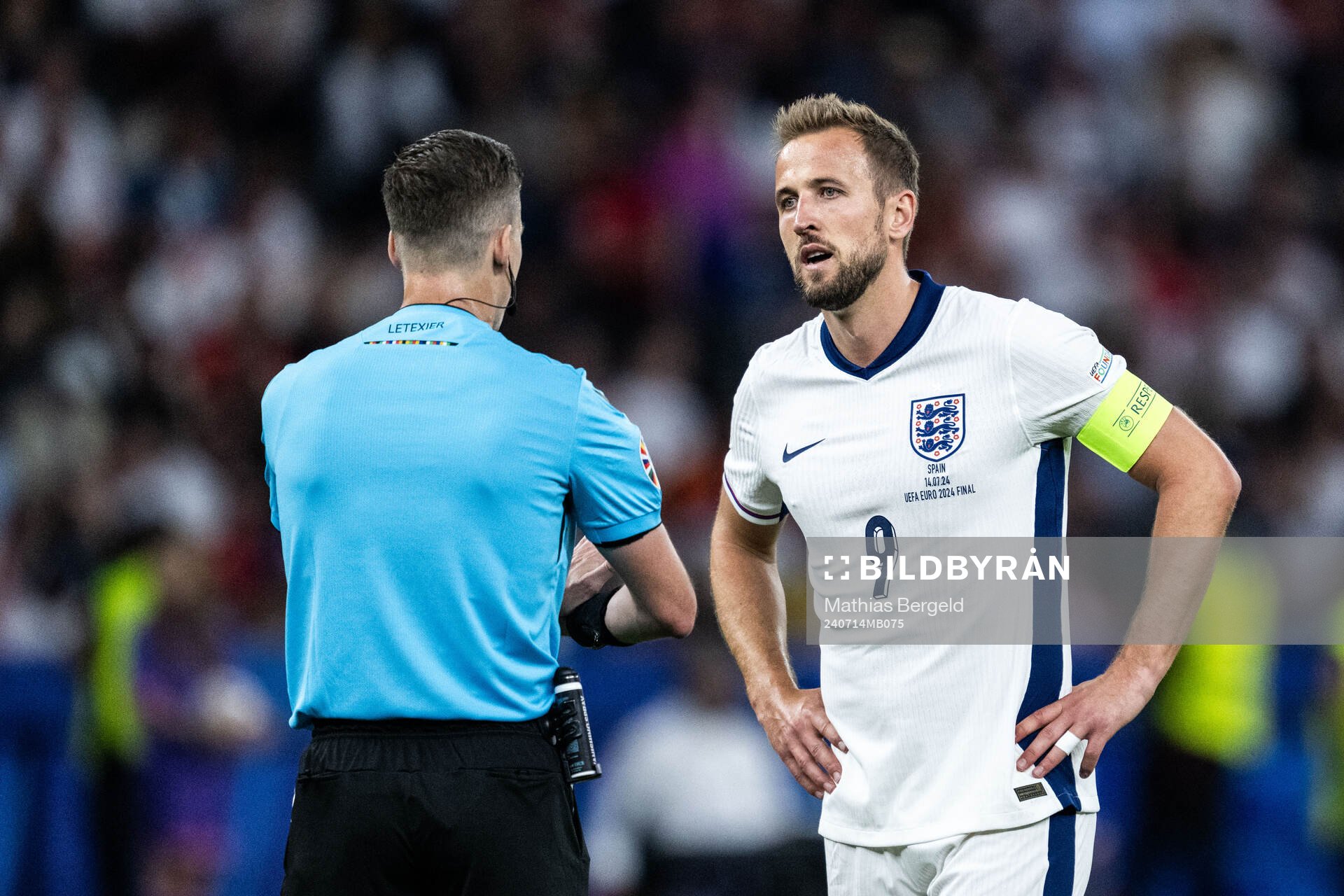 Harry Kane of England talks to referee Francois Letexier