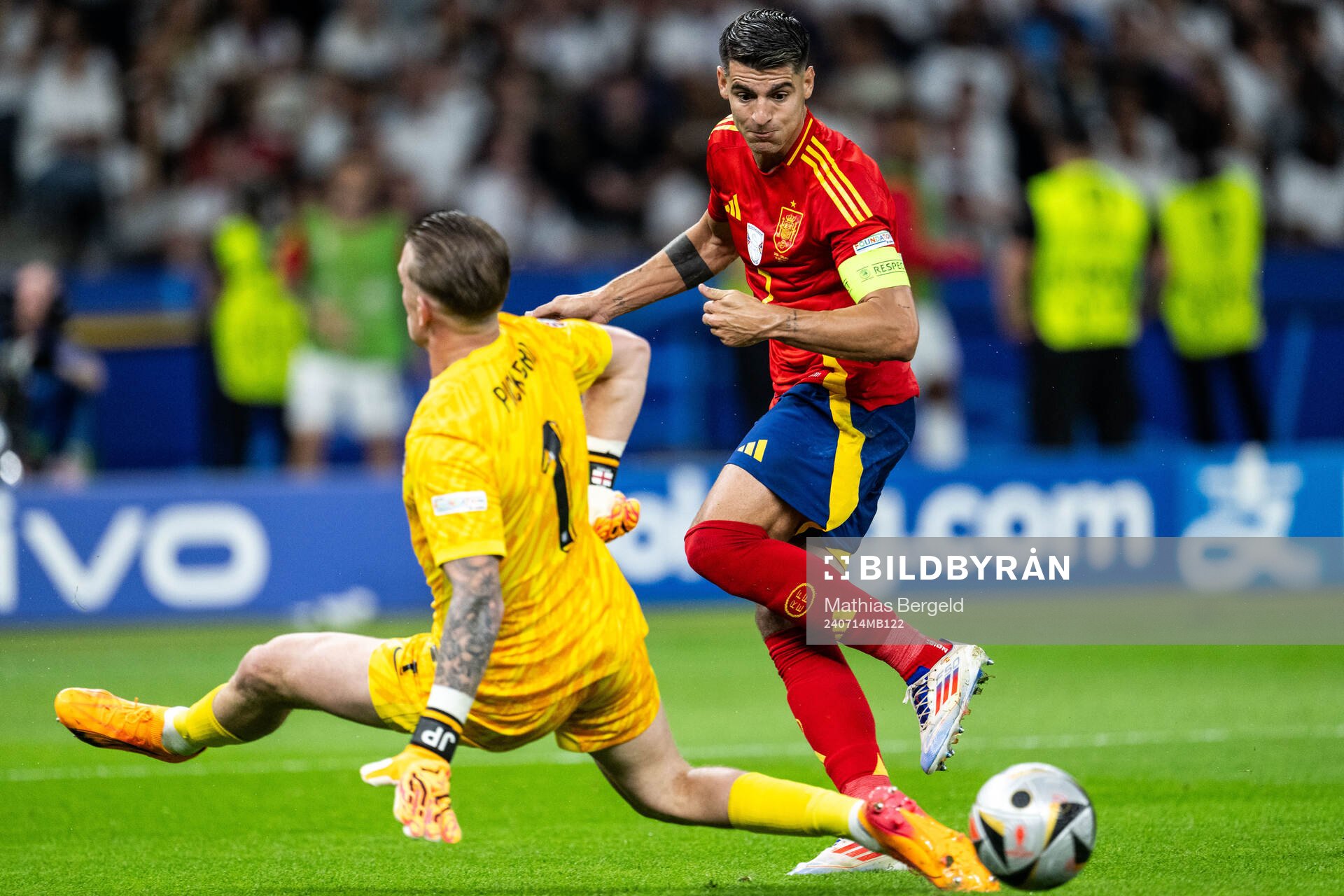 Goalkeeper Jordan Pickford of England and Alvaro Morata of