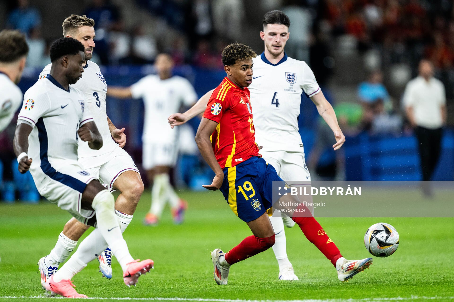 Lamine Yamal of Spain against Marc Guehi, Luke Shaw and