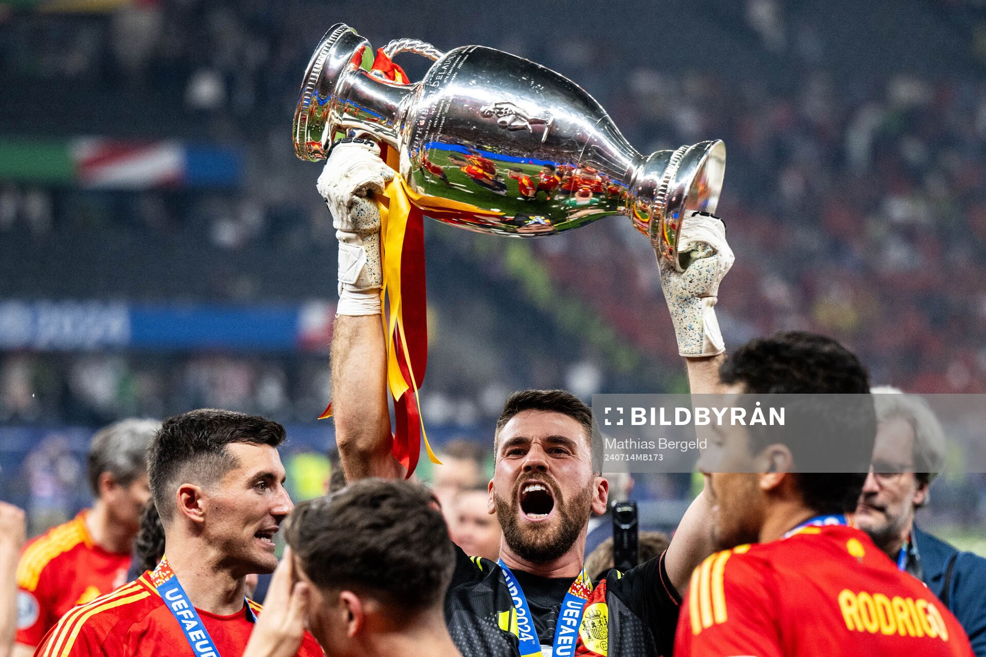 Goalkeeper Unai Simon Mendibil of Spain celebrates with the trophy after the UEFA Euro 2024 Football Championship final between Spain and England on July 14, 2024 in Berlin.