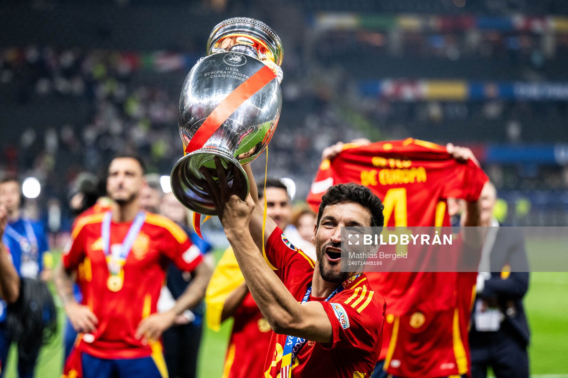Jesus Navas of Spain celebrates with the trophy