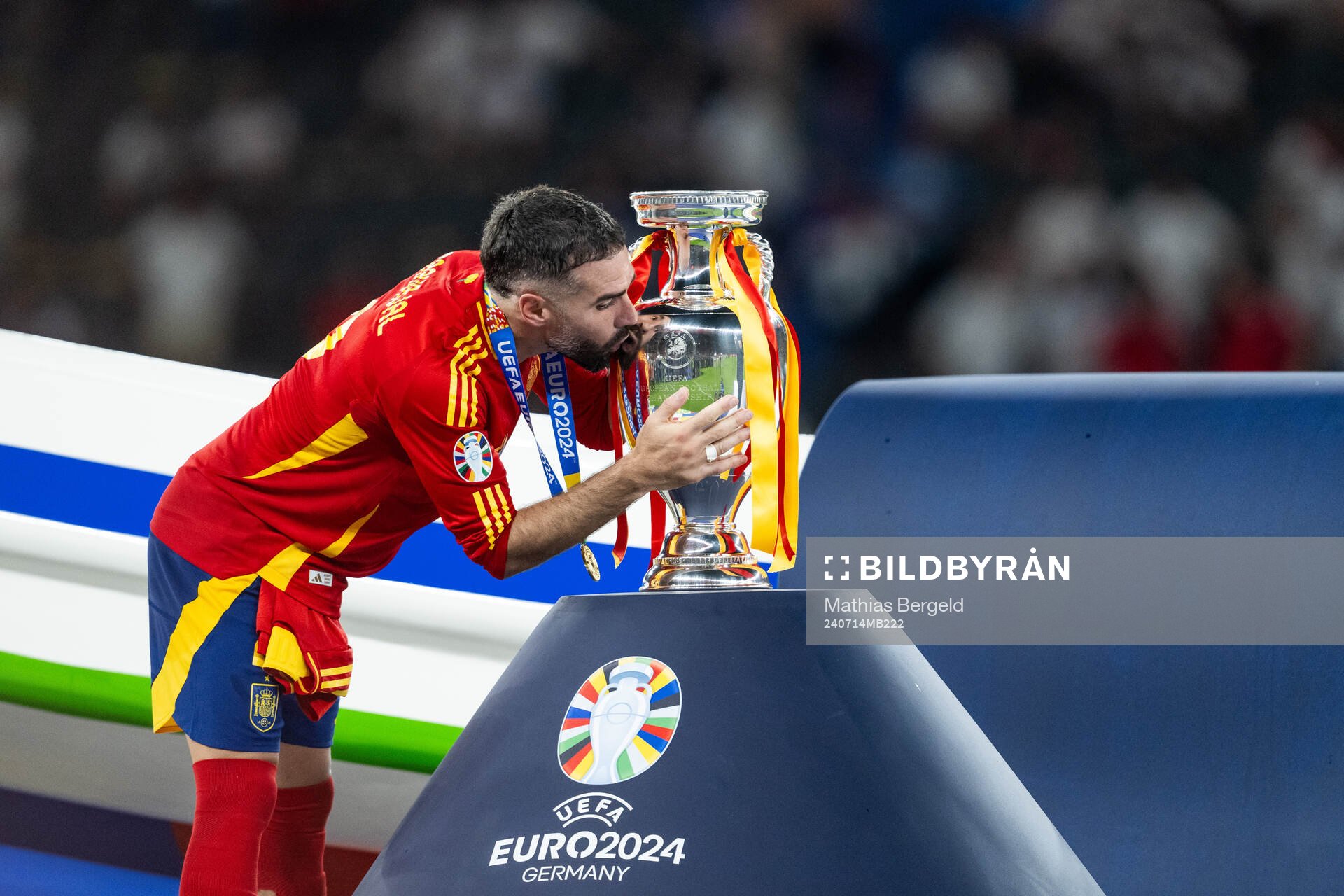 Daniel Carvajal of Spain kisses the trophy as he celebrats