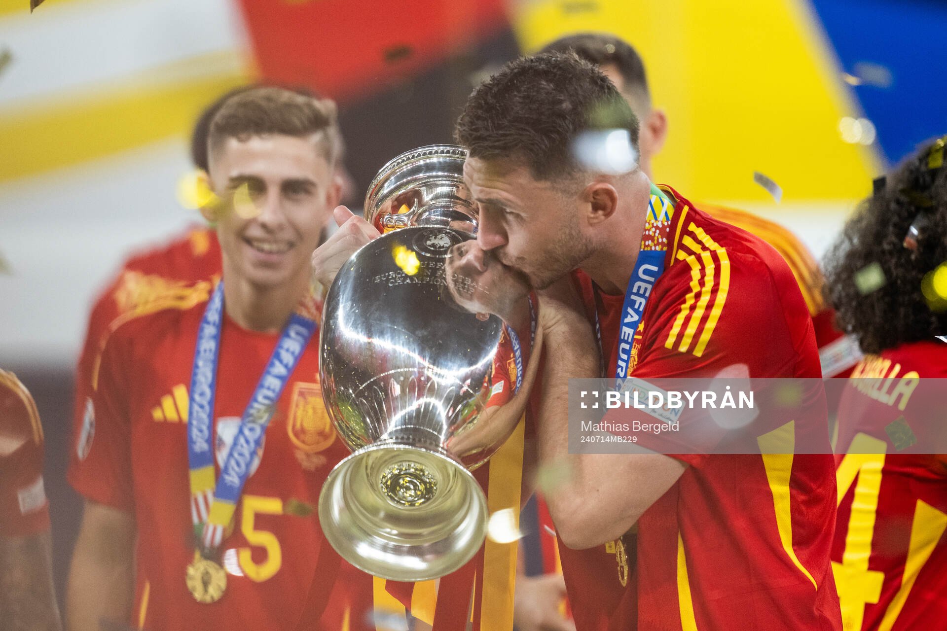 Joselu of Spain celebrates with the trophy