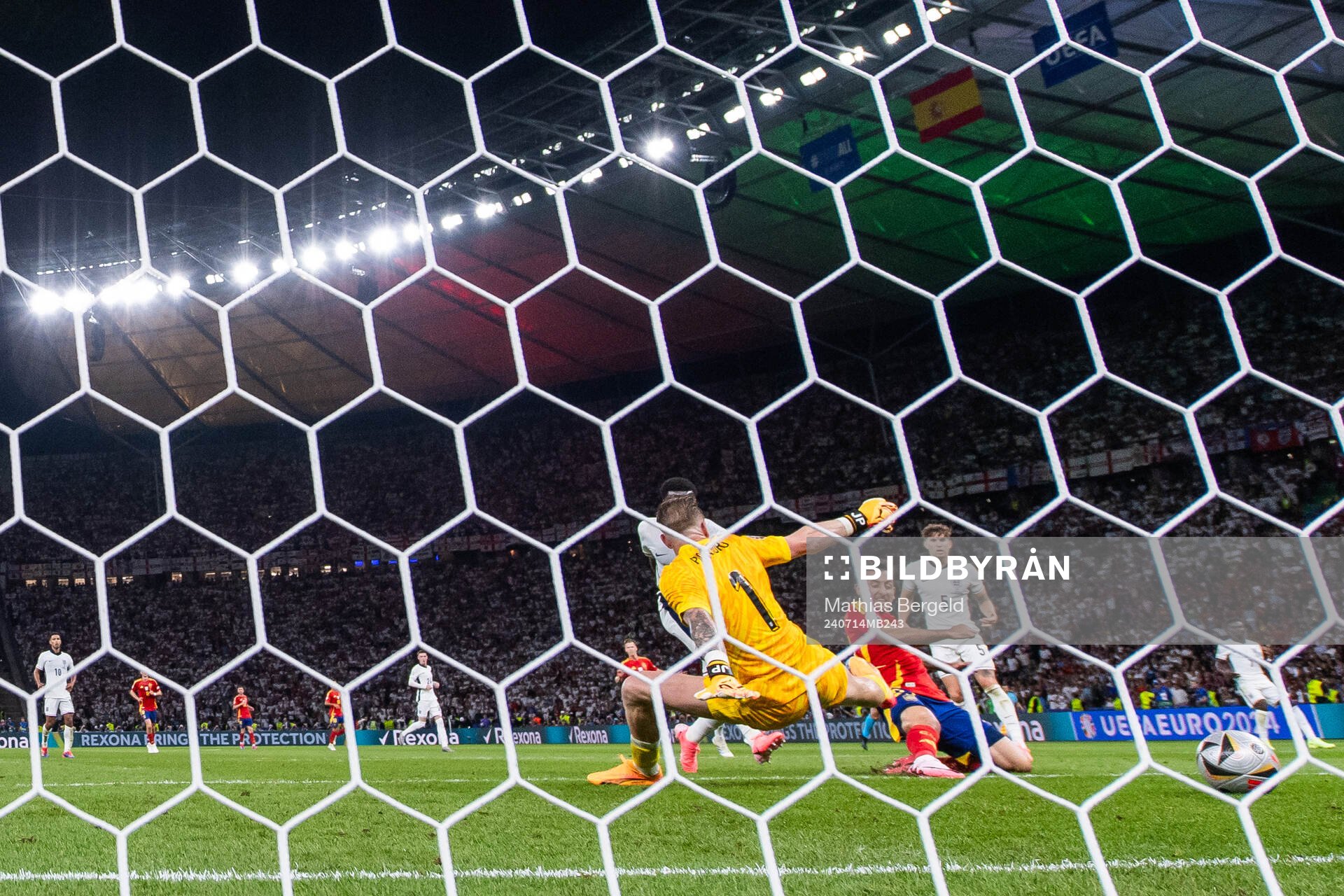 Mikel Oyarzabal of Spain scores 2-1 behind goalkeeper