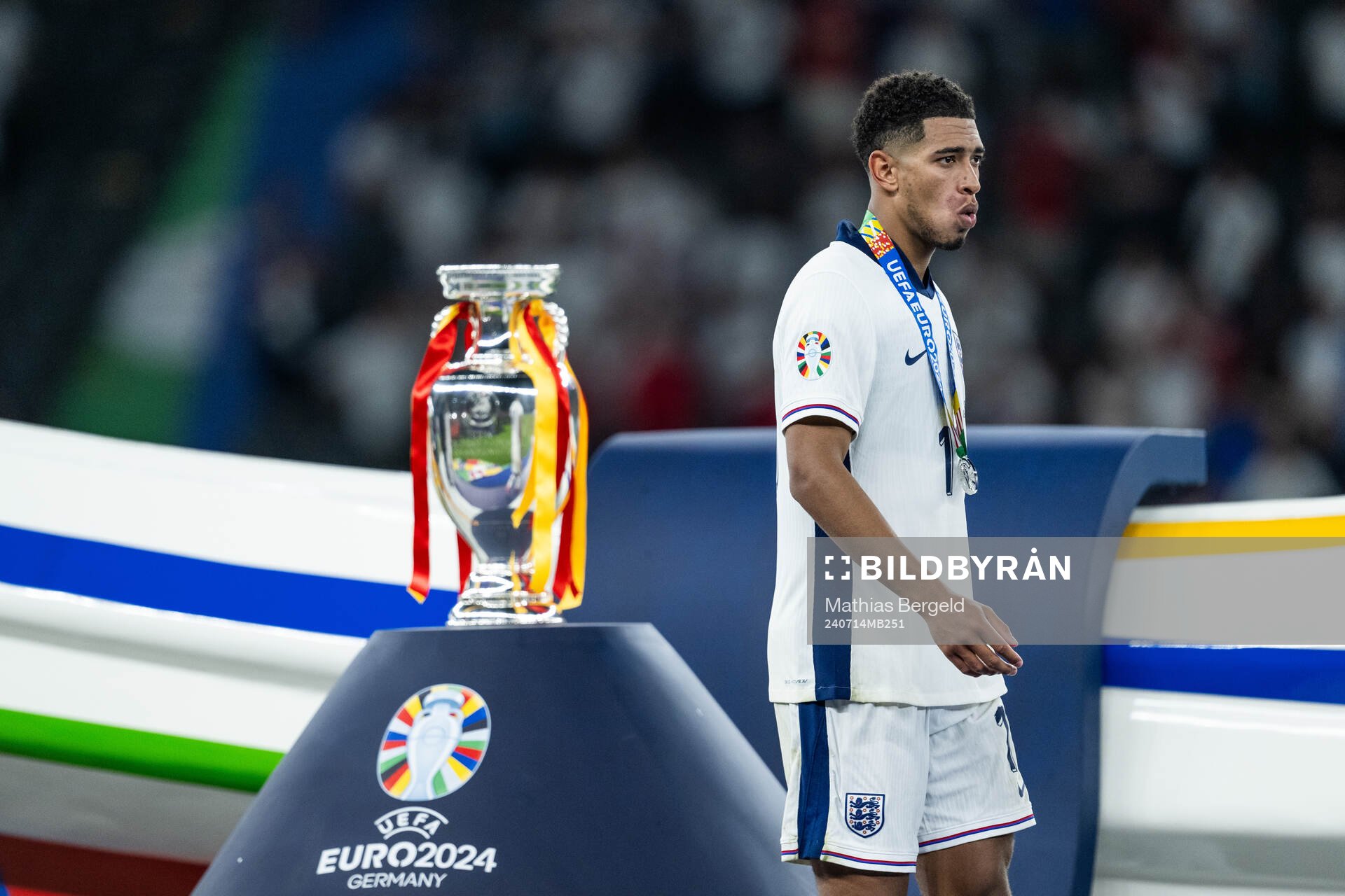 Jude Bellingham of England looks dejected as he walks past