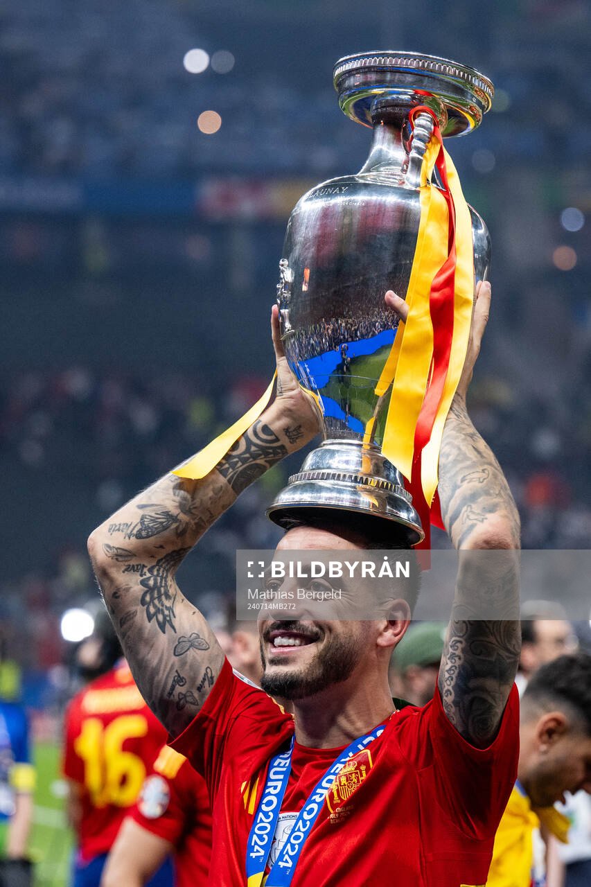 Joselu of Spain celebrates with the trophy