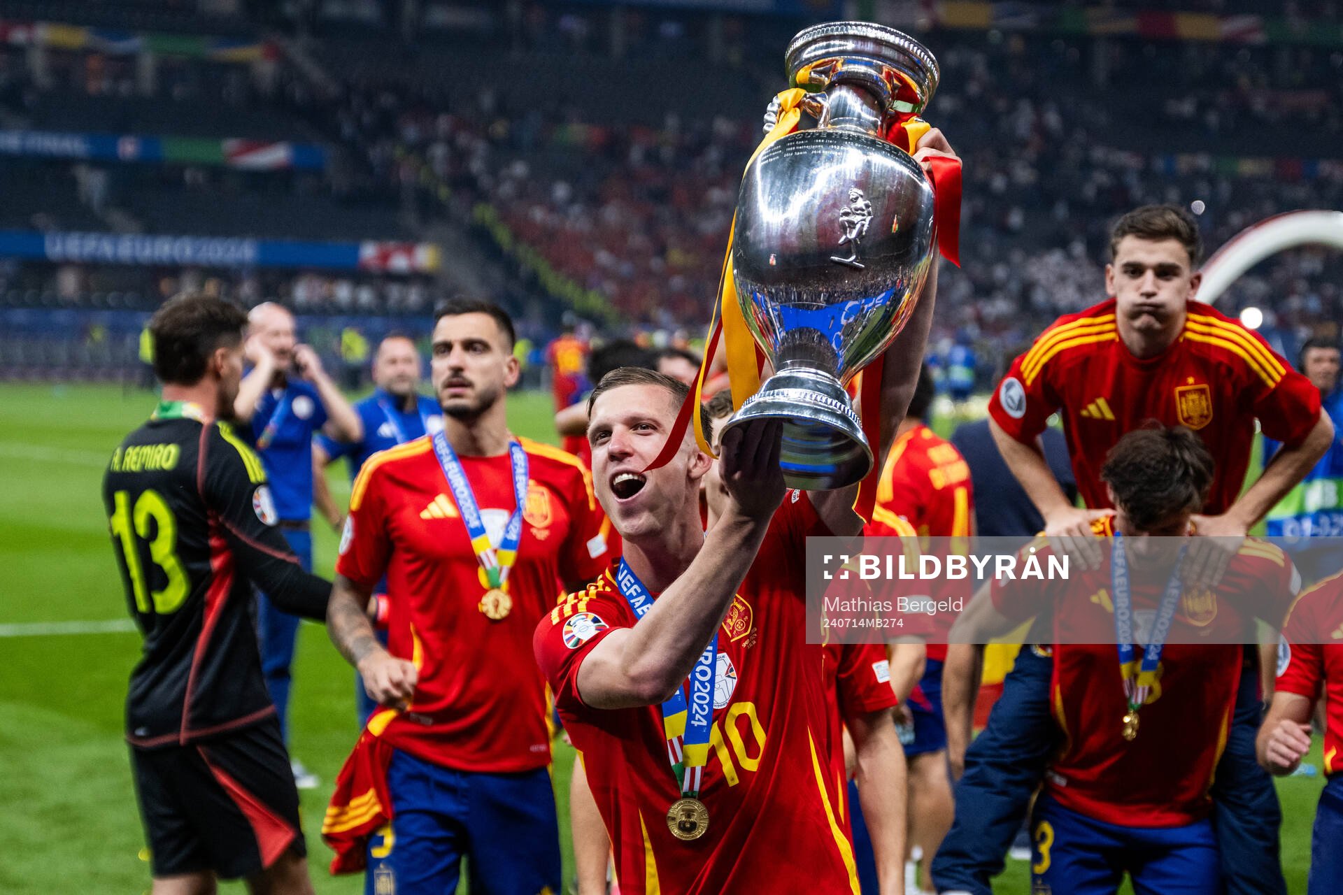 Daniel Olmo of Spain celebrates with the trophy