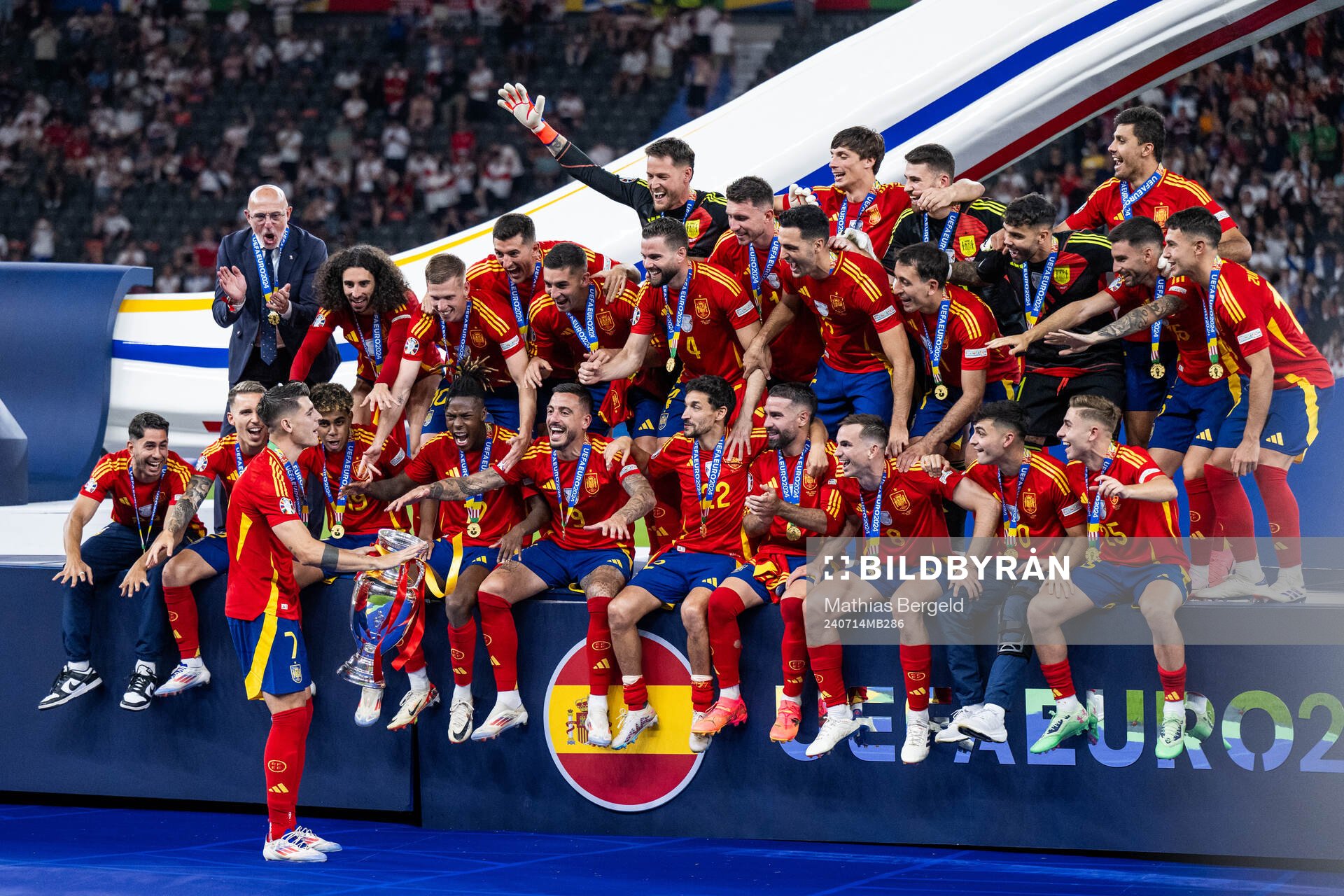 Alvaro Morata of Spain celebrates with the trophy in front