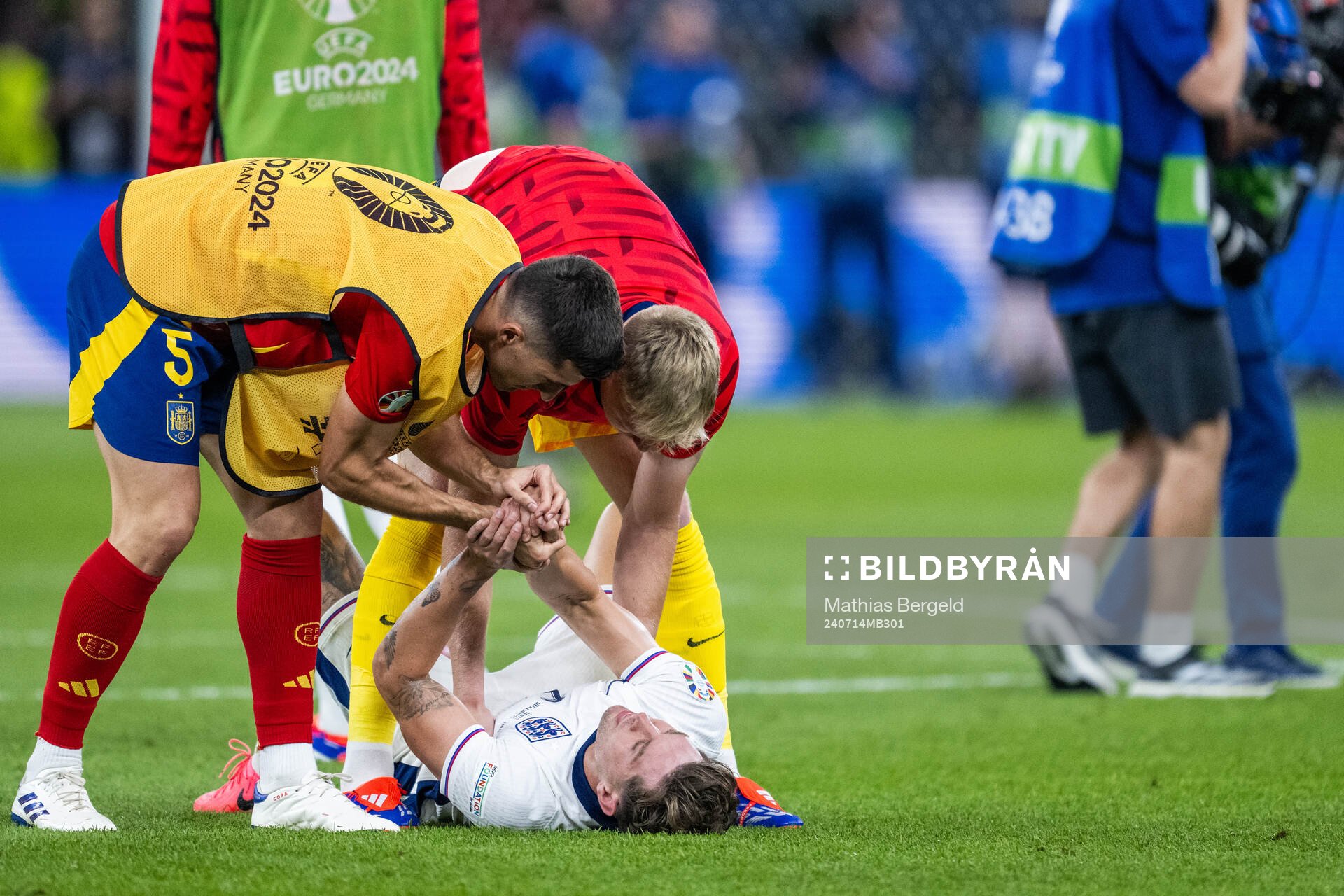 Daniel Vivian of Spain comforts John Stones of England who