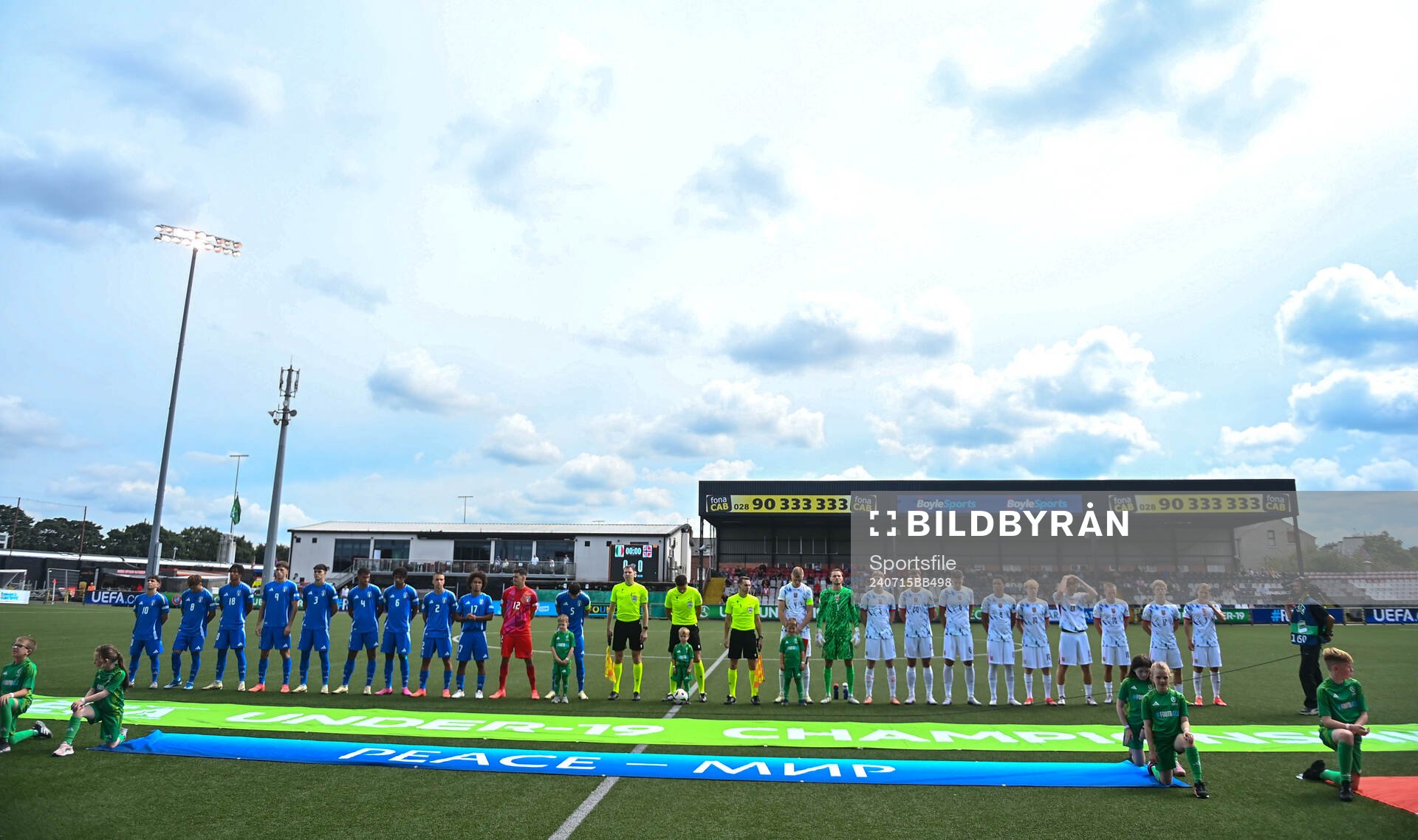 Players of both sides line up