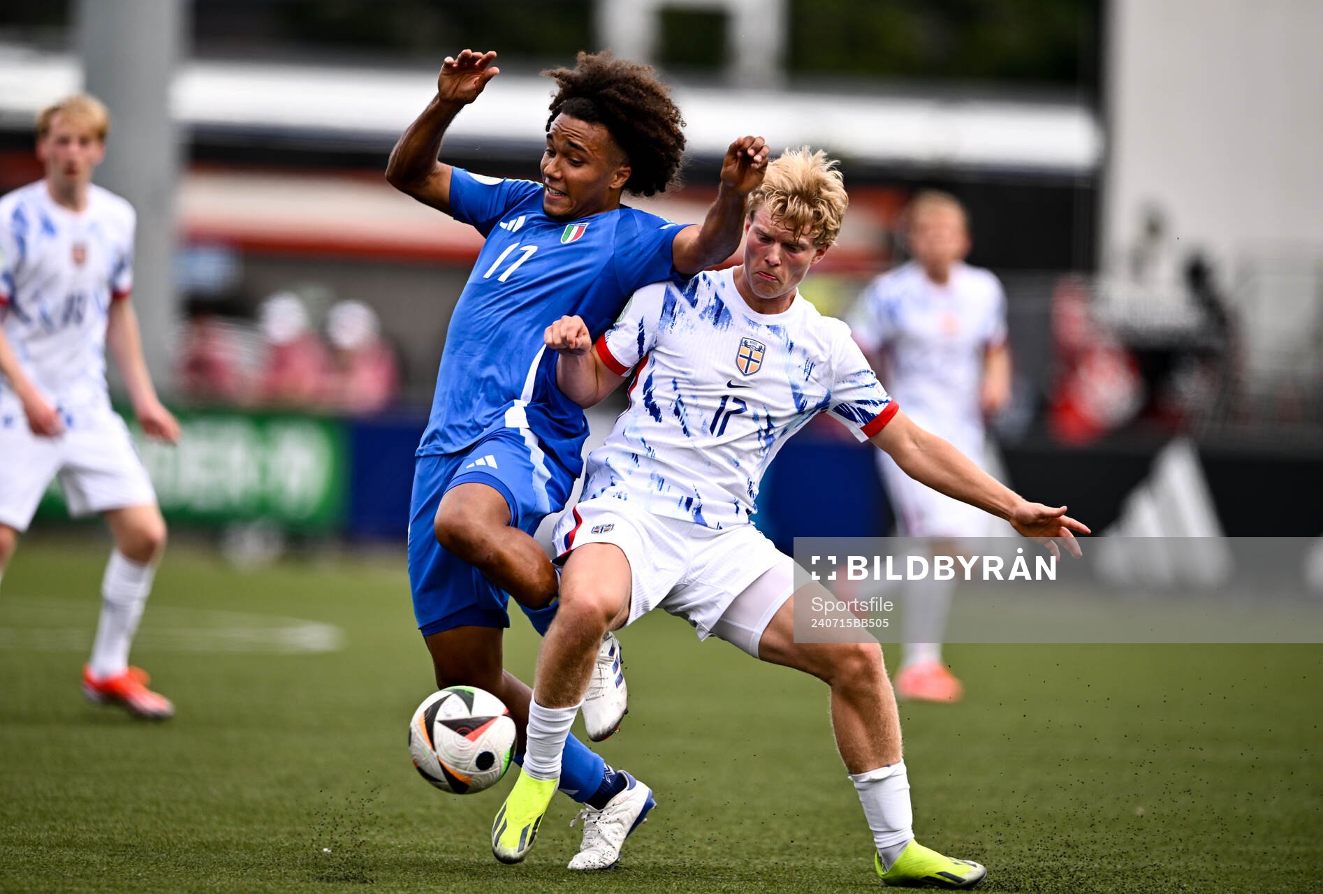 Aaron Ciammaglichella of Italy is tackled by Bork