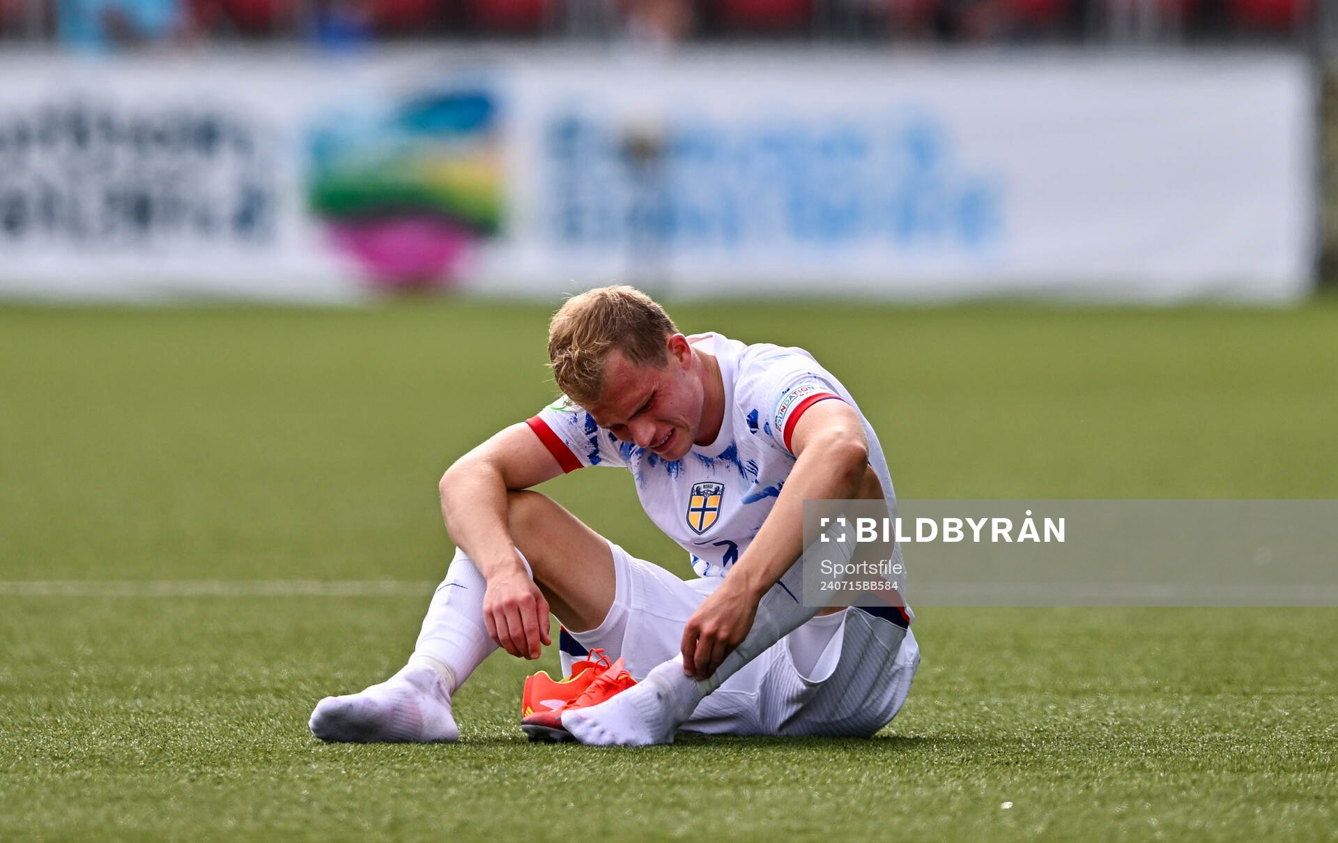 Aleksander Andresen of Norway dejected at the final whistle
