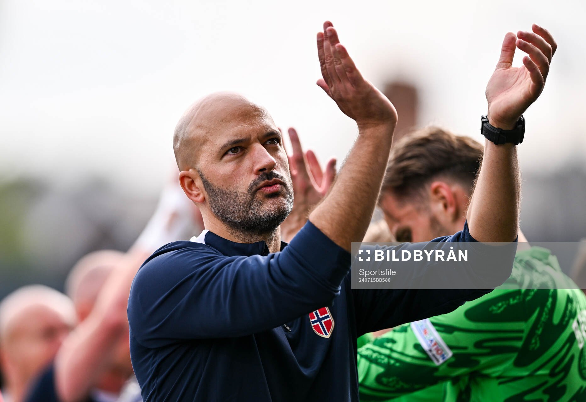 Norway head coach Luis Pimenta applauds toward the