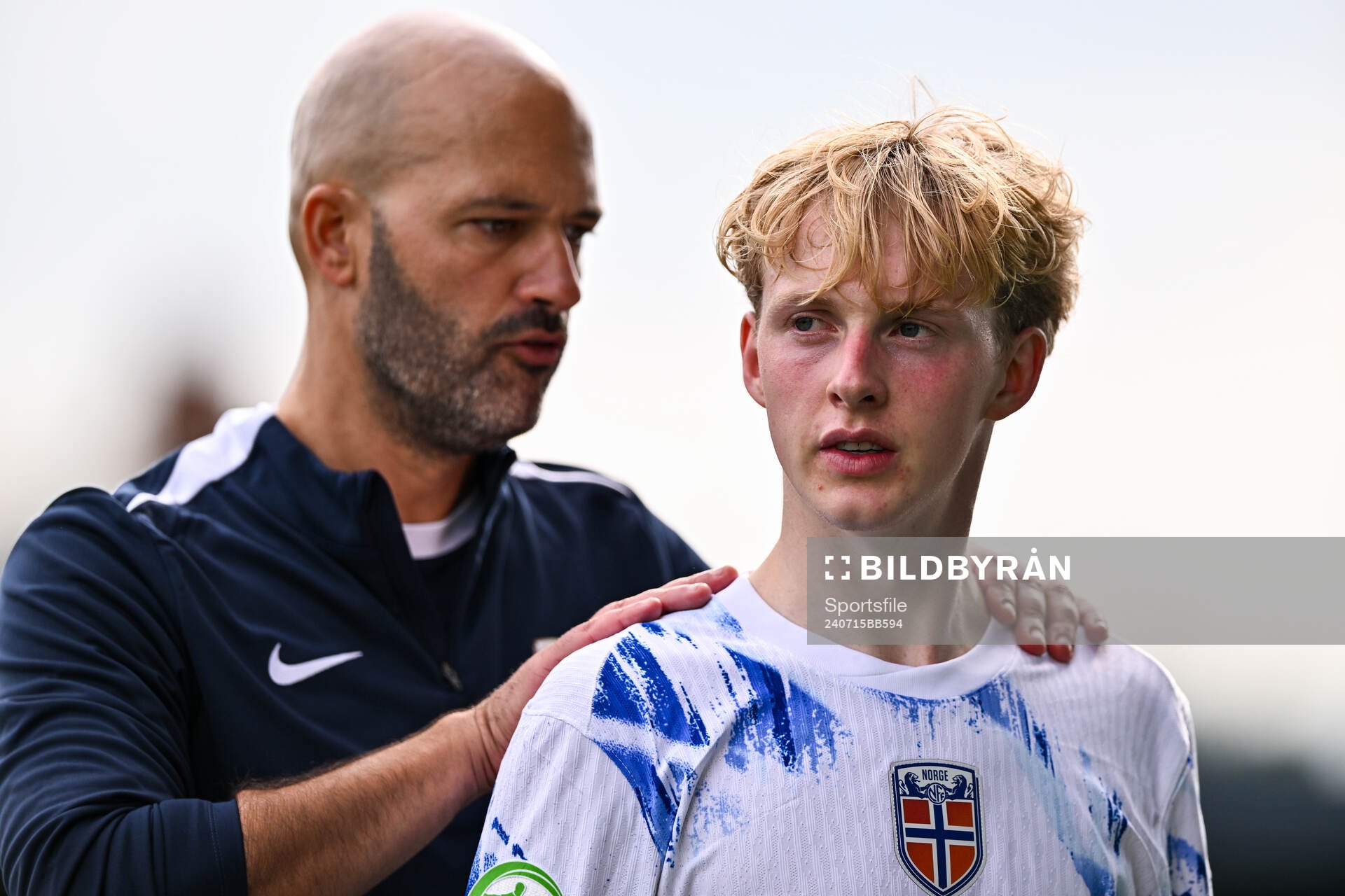 Sondre Granaas of Norway is consoled by Norway head coach