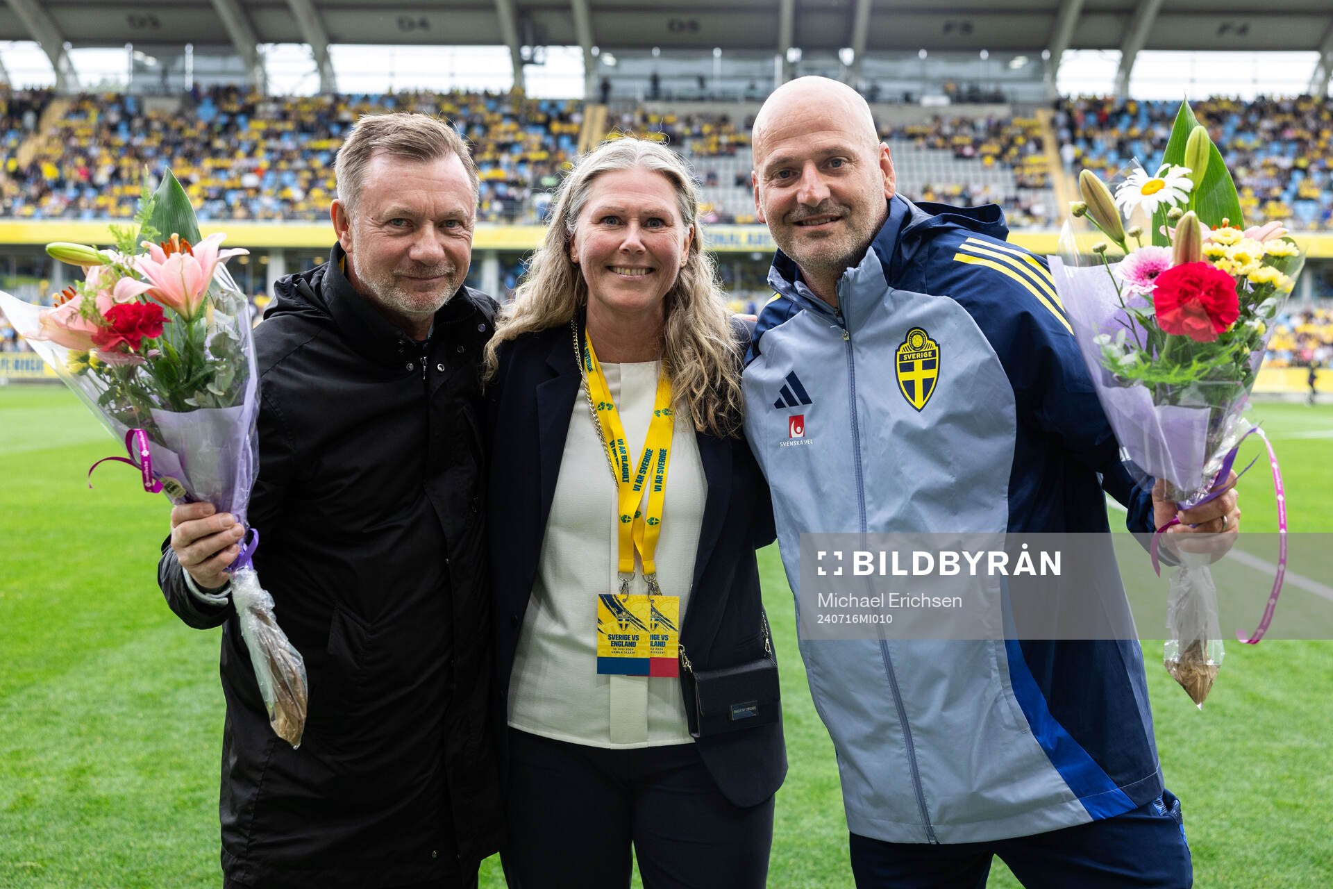 Head coach Peter Gerhardsson and Assistant coach Magnus Wikman is acknowledged for 100 caps by Nina Lindström ahead of the UEFA Women's Euro Qualifier football match between Sweden and England on July 16, 2024 in Göteborg.