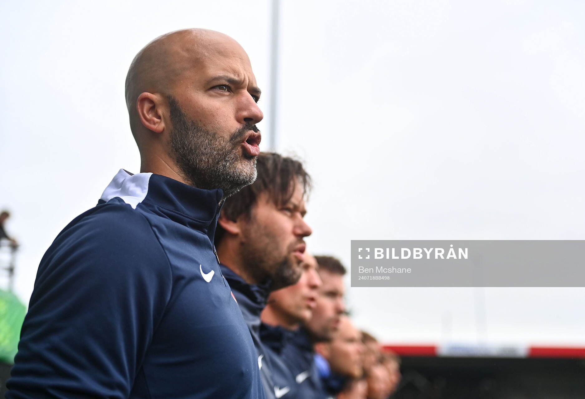 Norway head coach Luis Pimenta sings the national anthem