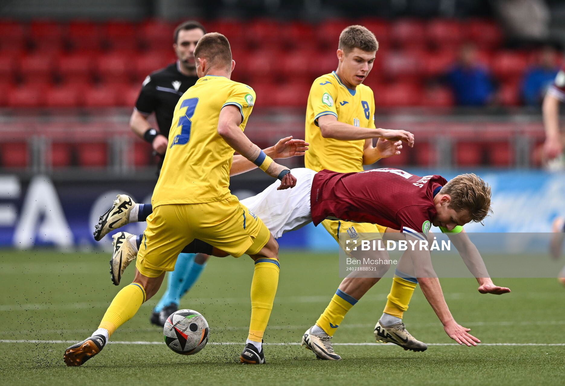 Benjamin Thoresen Faraas of Norway is tackled by Ivan