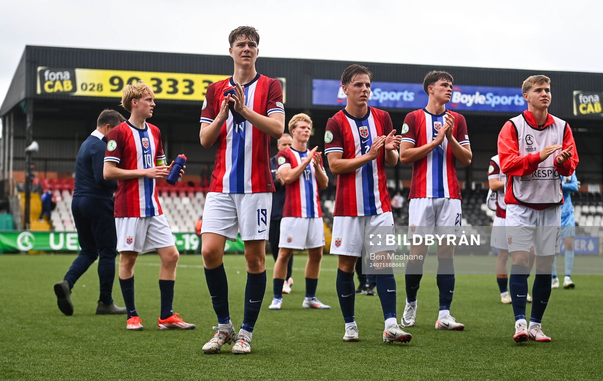 Norway players applaud toward the travelling supporters