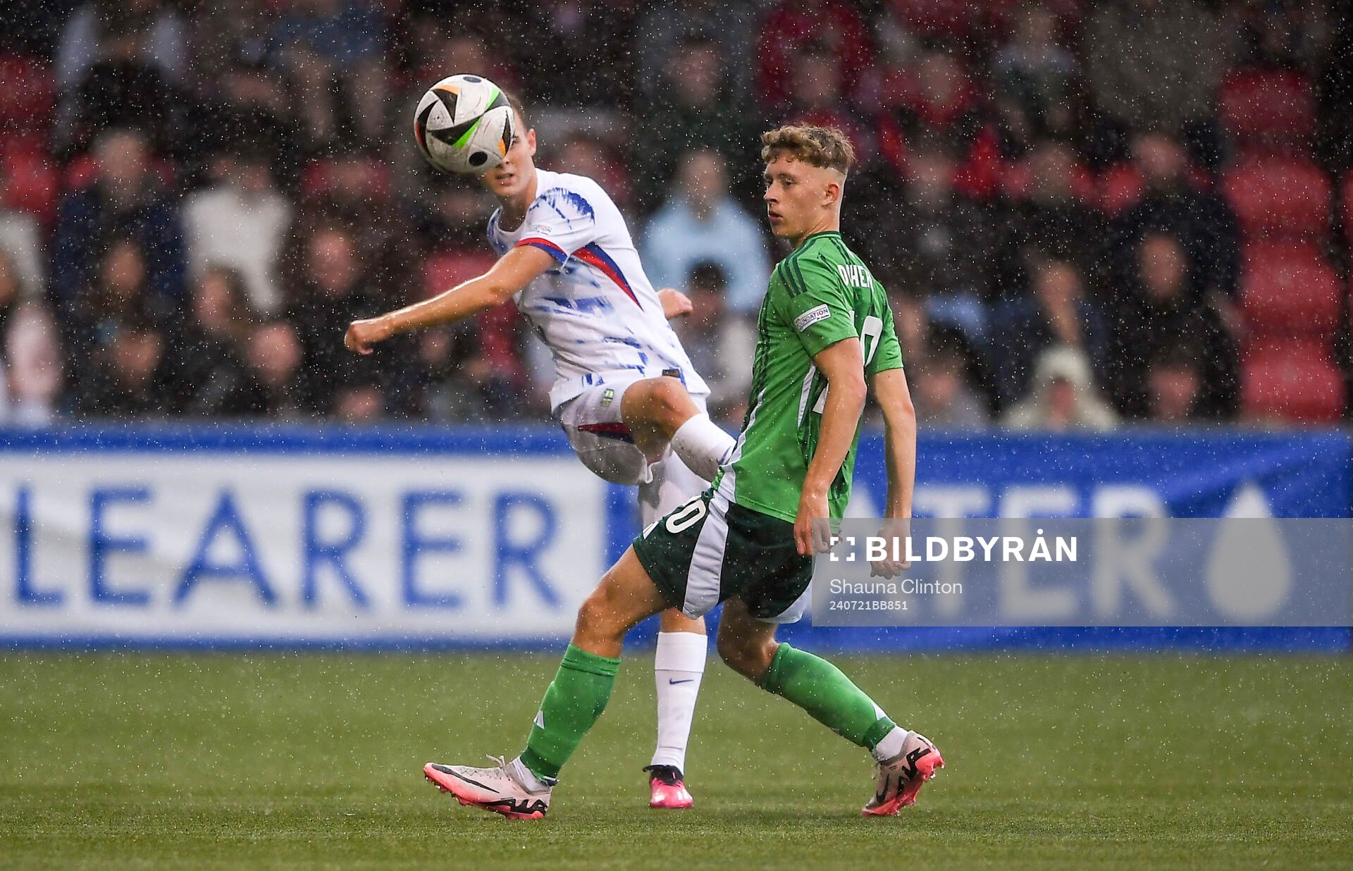 Filip Loftesnes-Bjune of Norway in action against Aodhan Doherty of Northern Ireland during the UEFA European Under-19 Championship group stage football match between Northern Ireland and Norway on July 21, 2024 in Belfast.