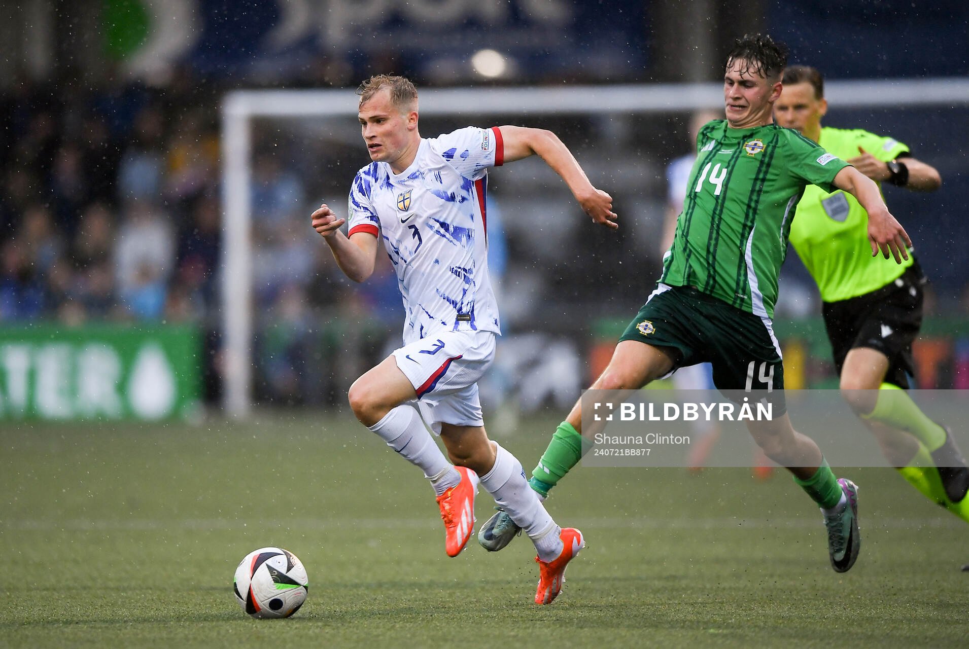 Alexander Andresen of Norway is tackled by Jack Doherty of Northern Ireland during the UEFA European Under-19 Championship group stage football match between Northern Ireland and Norway on July 21, 2024 in Belfast.