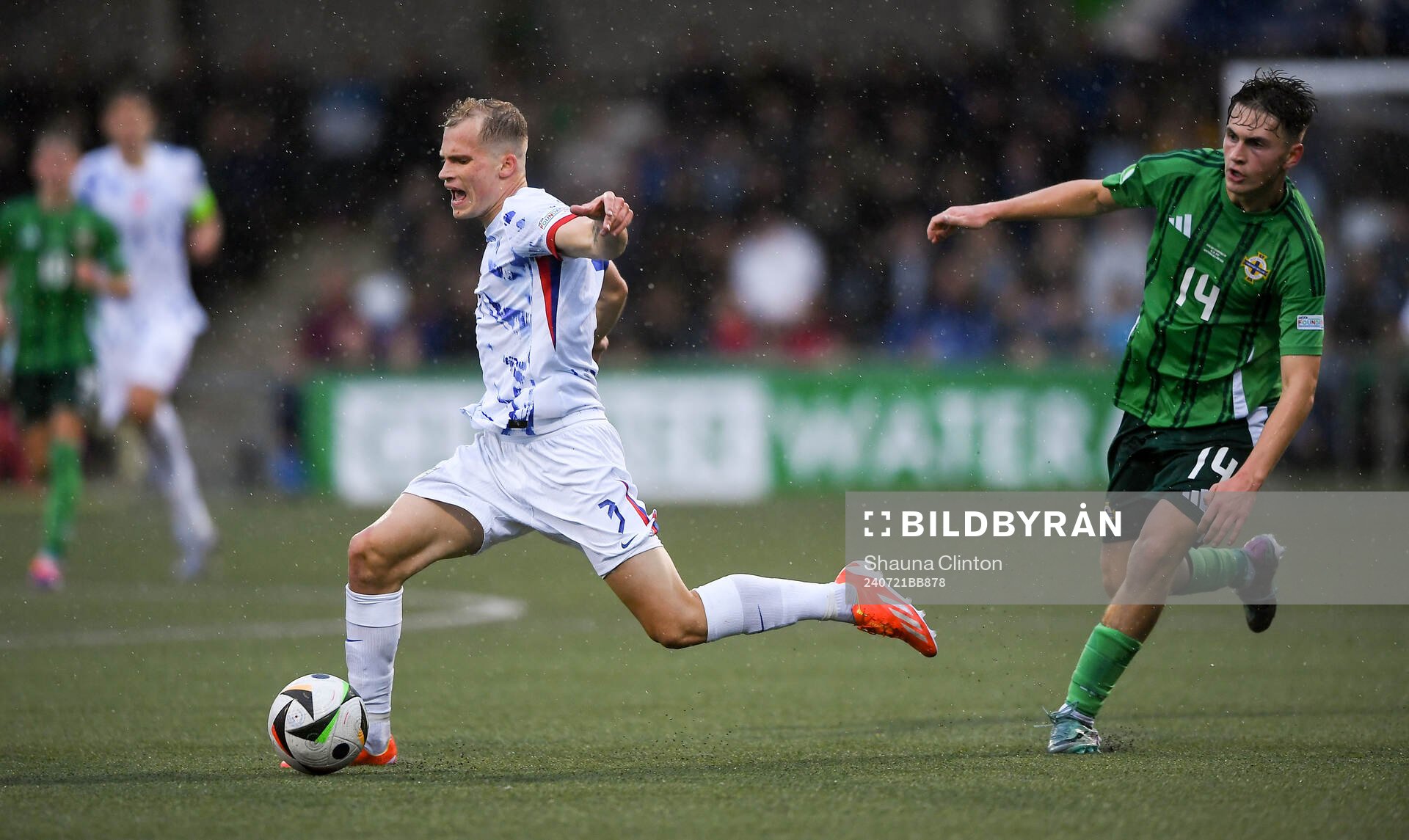 Alexander Andresen of Norway is tackled by Jack Doherty of Northern Ireland during the UEFA European Under-19 Championship group stage football match between Northern Ireland and Norway on July 21, 2024 in Belfast.