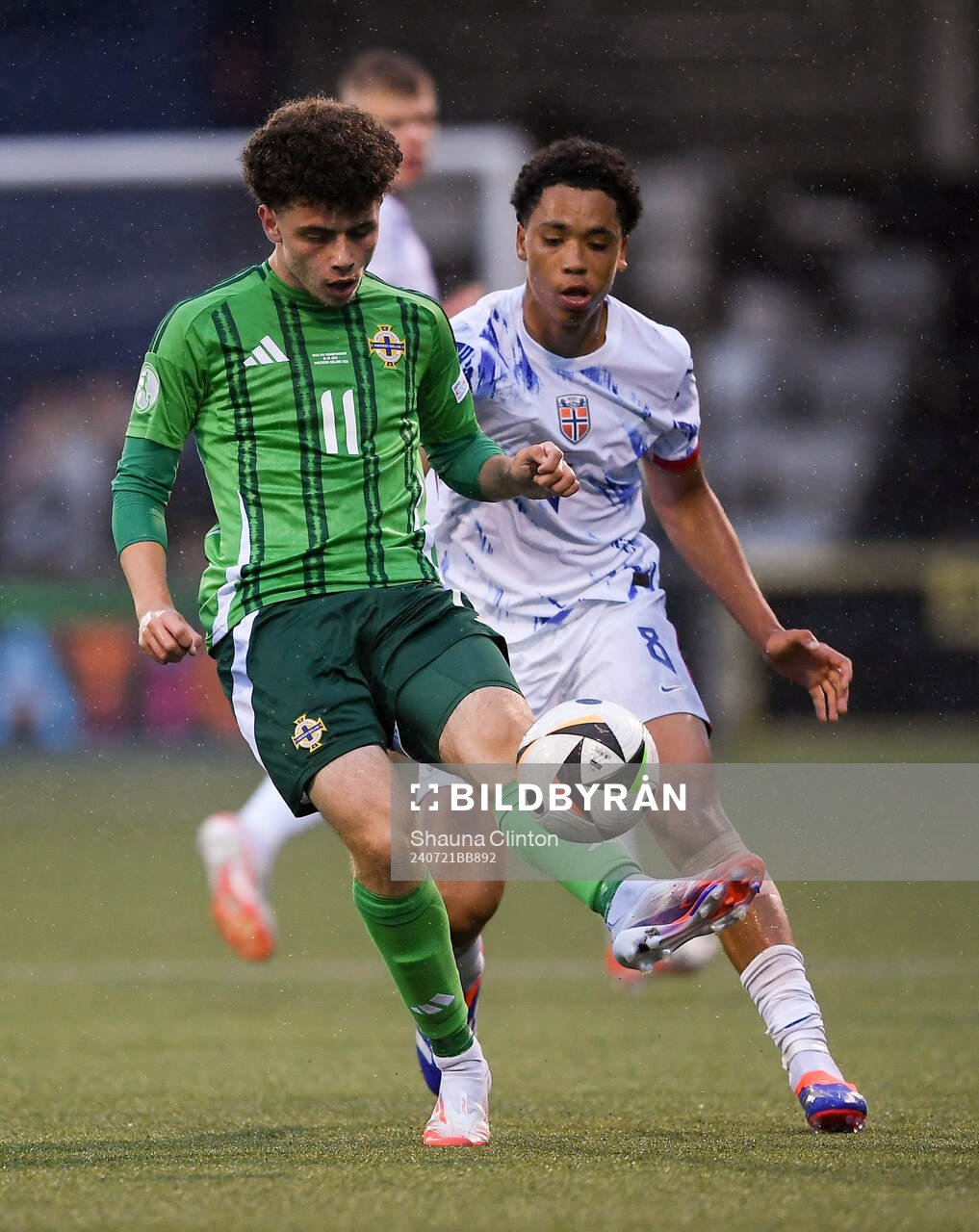 Kieran Morrison of Northern Ireland in action against Travis Hernes of Norway during the UEFA European Under-19 Championship group stage football match between Northern Ireland and Norway on July 21, 2024 in Belfast. 

