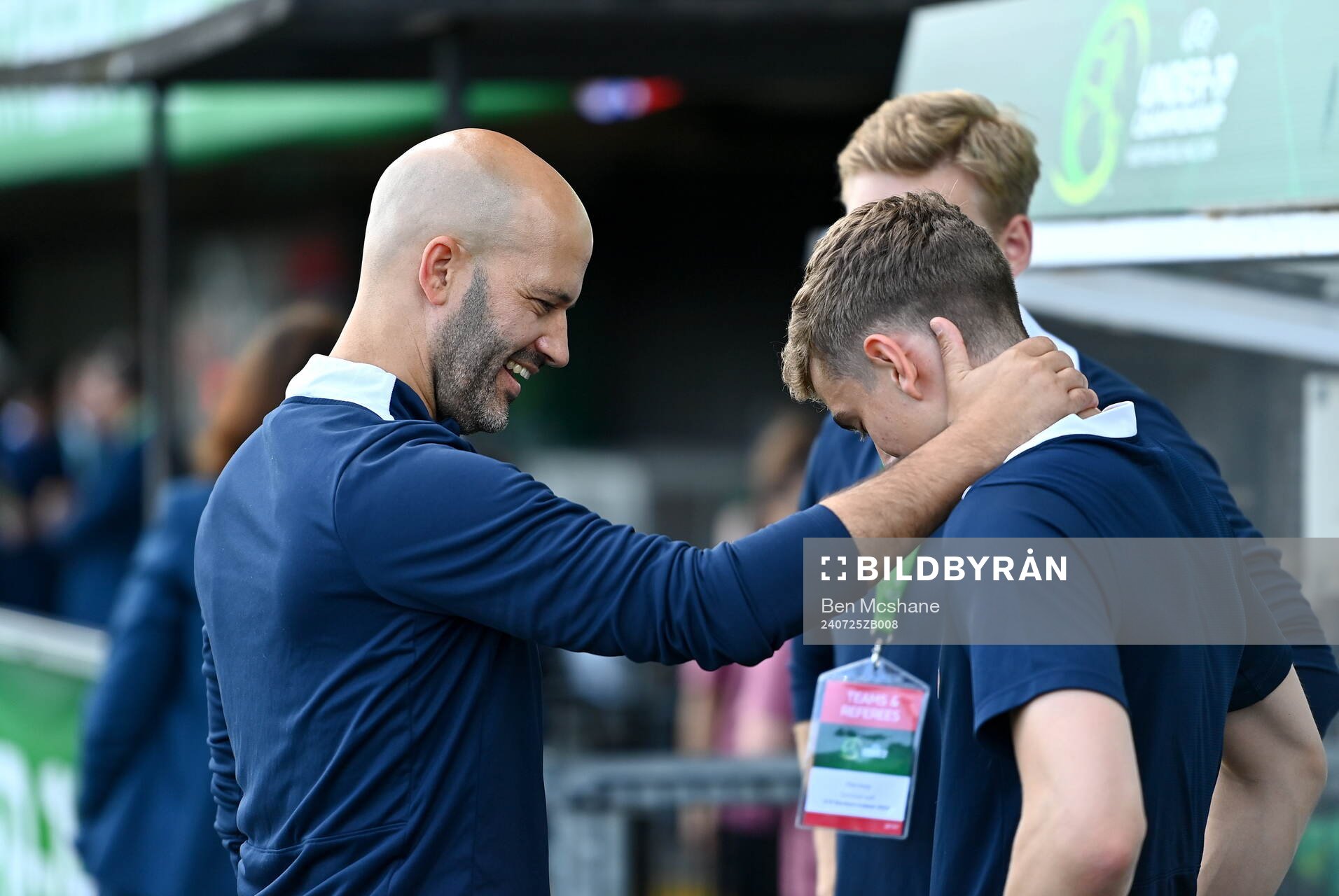 Norway head coach Luis Pimenta shares a joke with a member