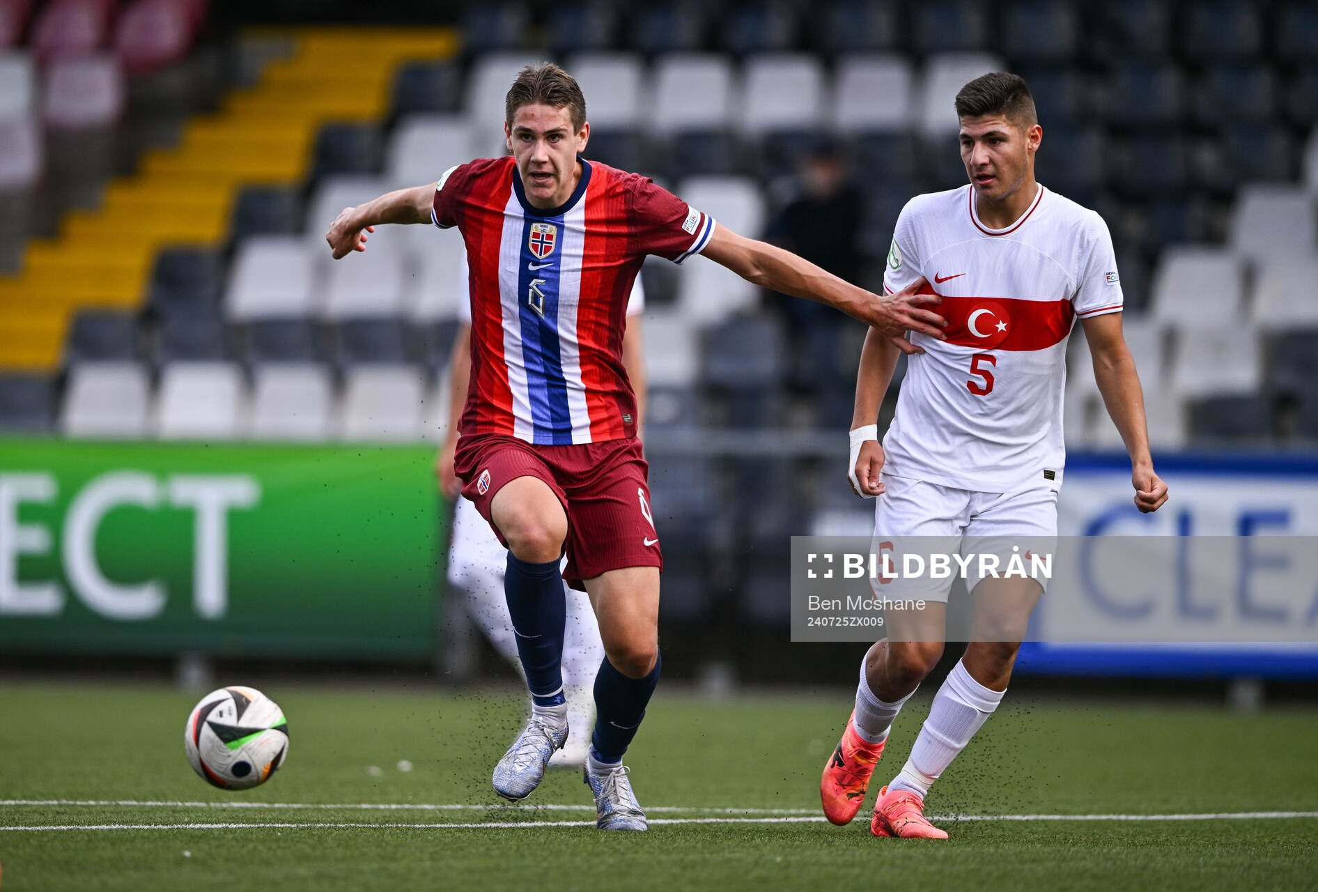 Eivind Helland of Norway in action against Efe Sarikaya of