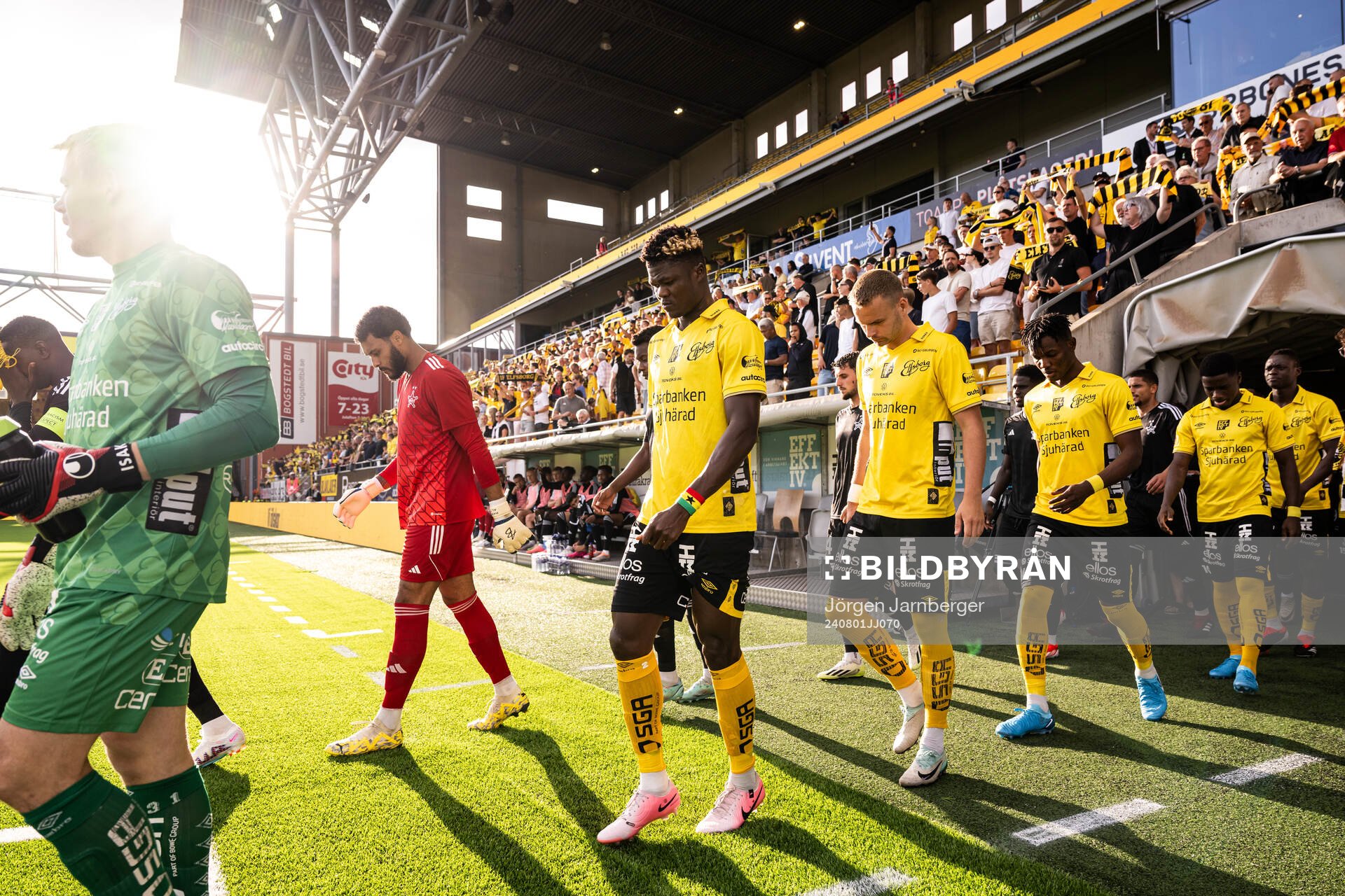 The teams enter the field