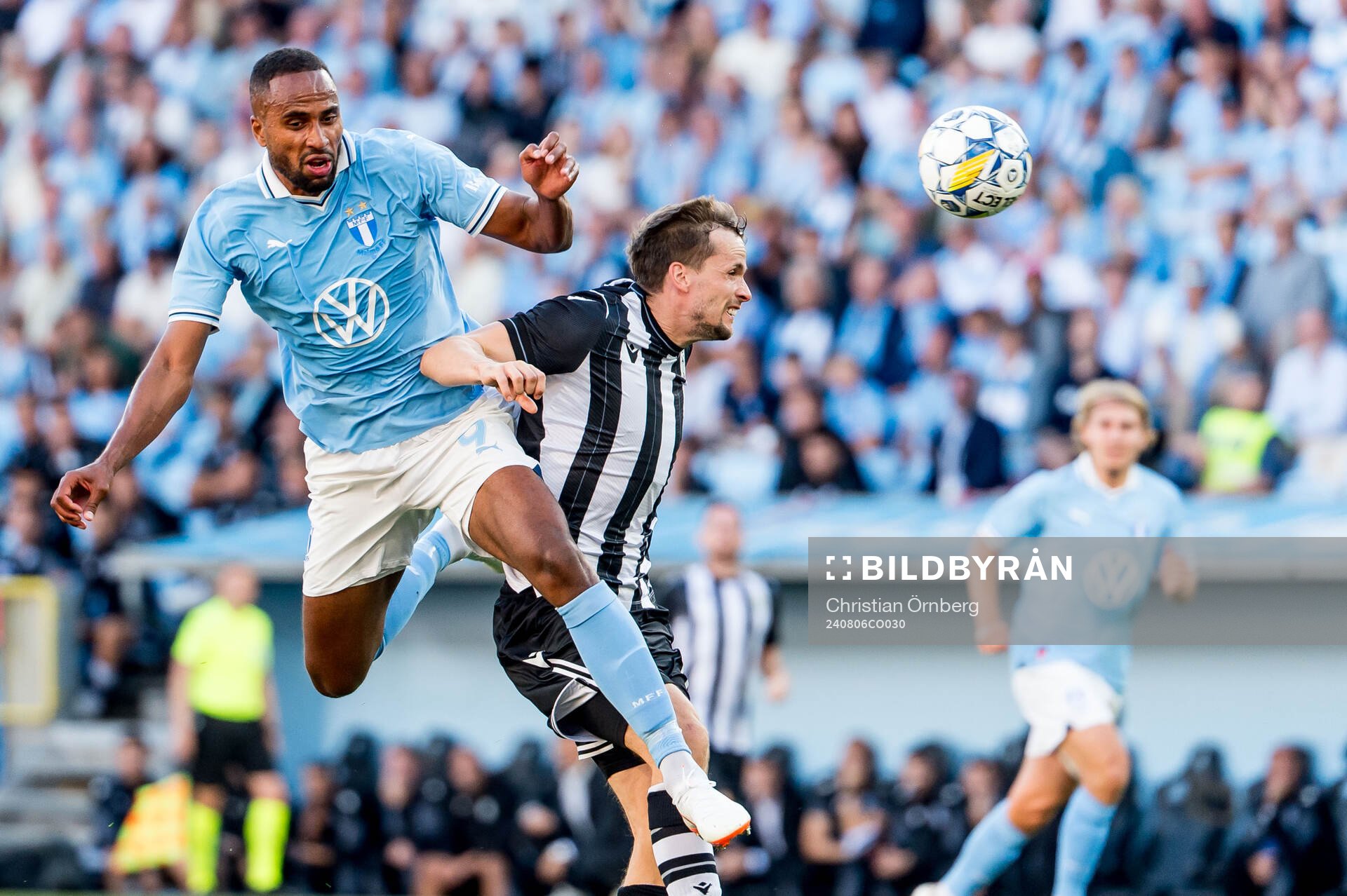 Isaac Kiese Thelin of Malmö FF and Tomasz Kedziora of PAOK during the UEFA Champions League football match between Malmö FF and PAOK on August 6, 2024 in Malmö.