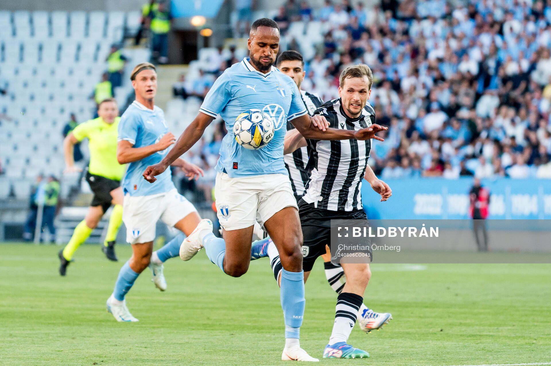 Isaac Kiese Thelin of Malmö FF and Tomasz Kedziora of PAOK during the UEFA Champions League football match between Malmö FF and PAOK on August 6, 2024 in Malmö.