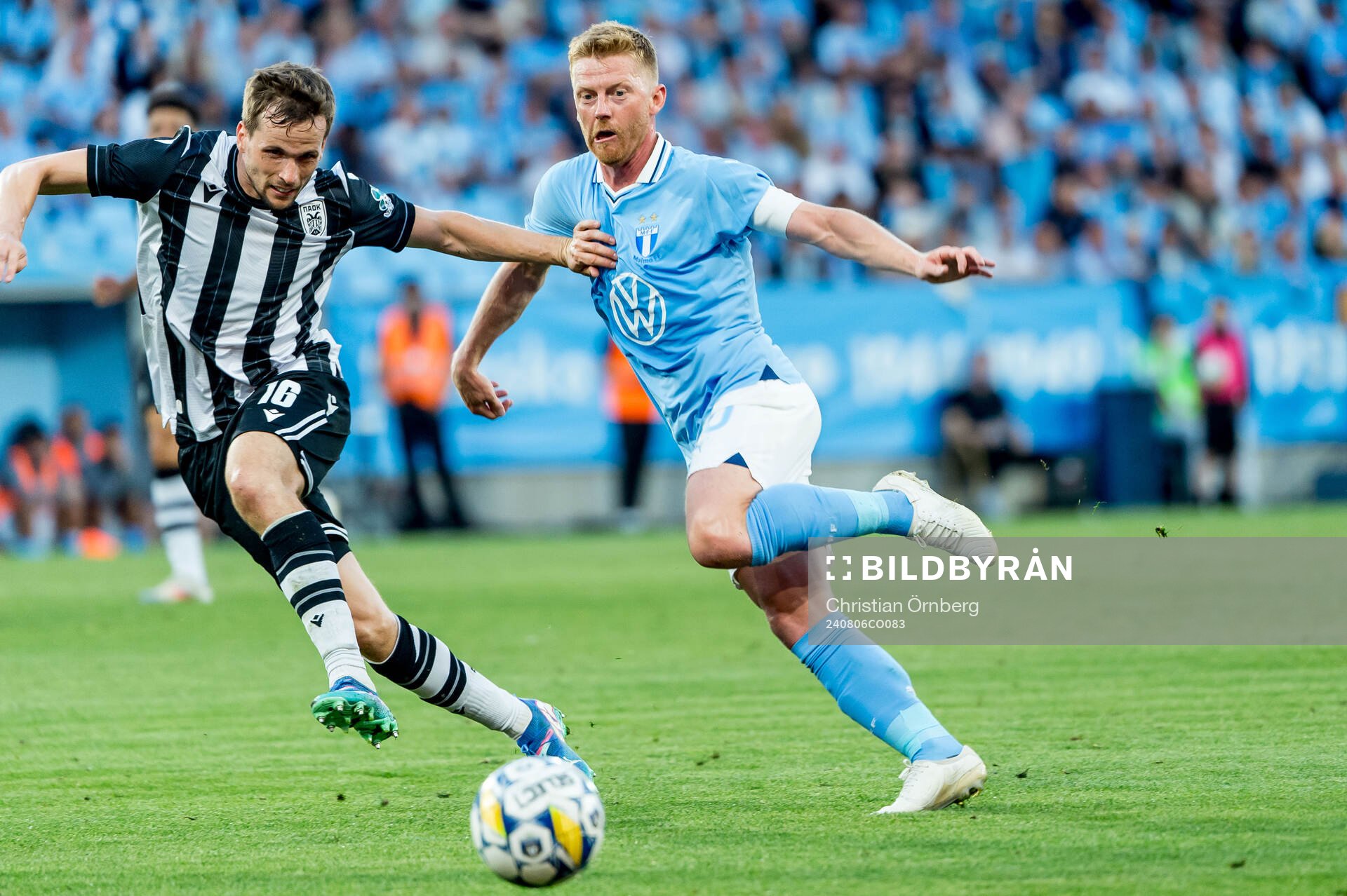 Tomasz Kedziora of PAOK and Anders Christiansen of Malmö FF during the UEFA Champions League football match between Malmö FF and PAOK on August 6, 2024 in Malmö.