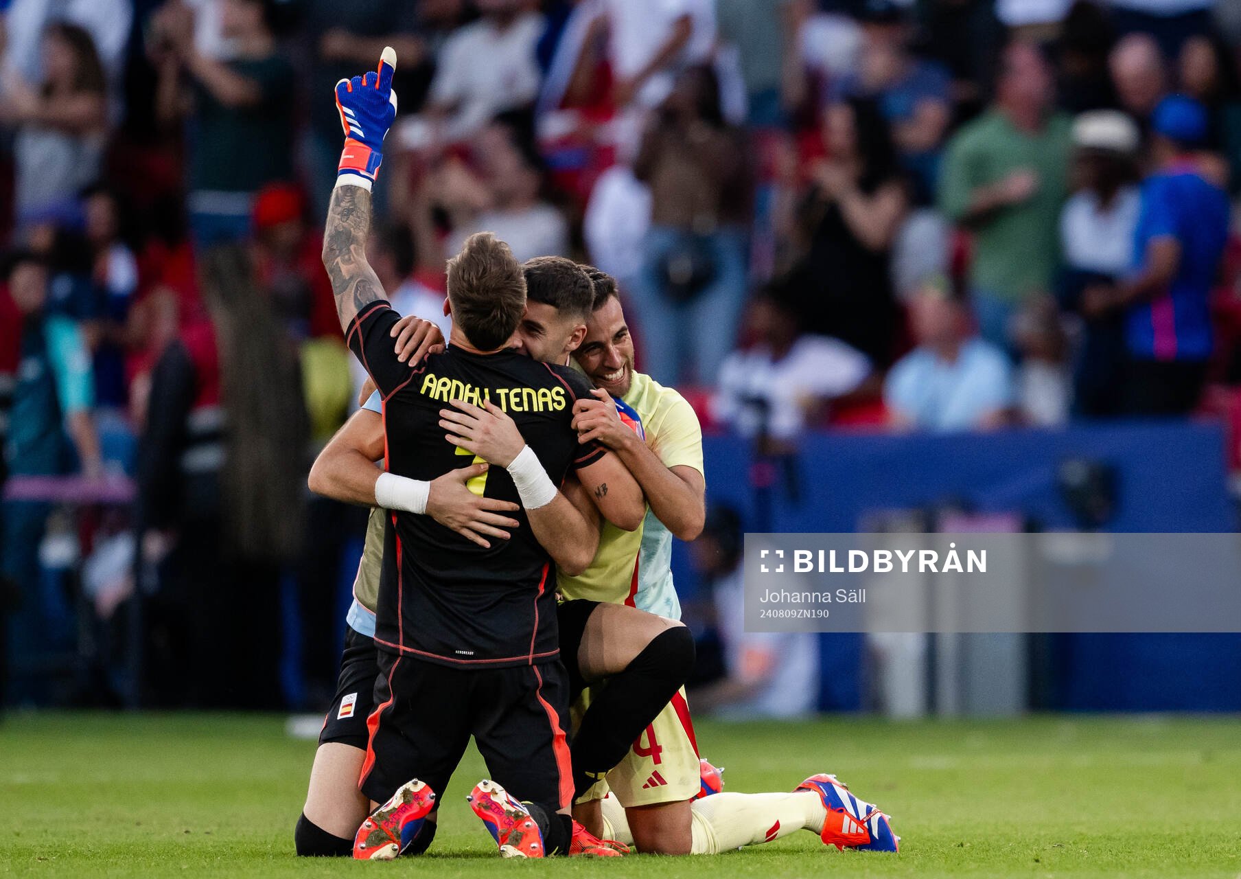 Goalkeeper Arnau Tenas and Eric Garcia of Spain celebrate