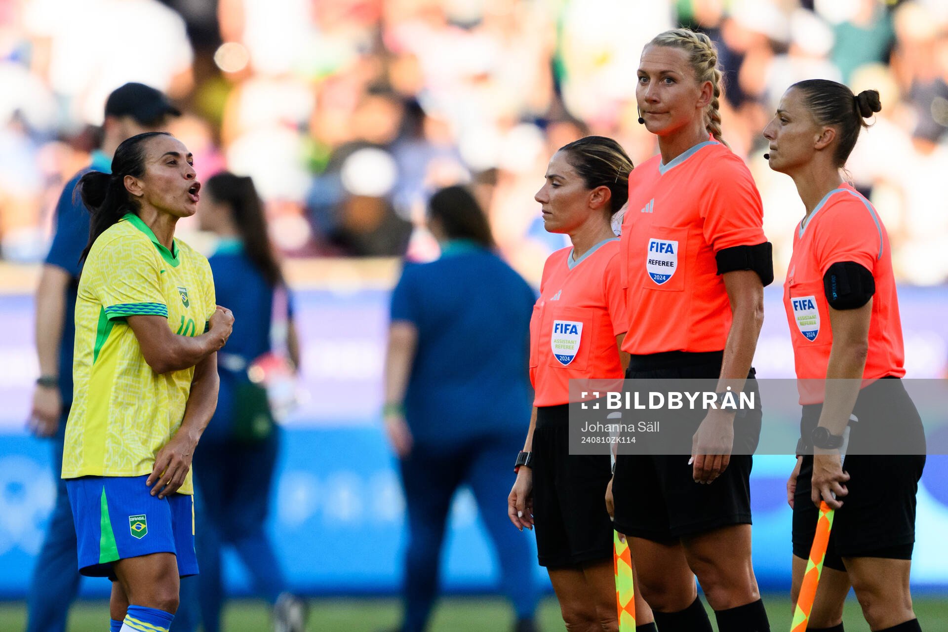 Marta of Brazil reacts against referee Francesca di Monte,