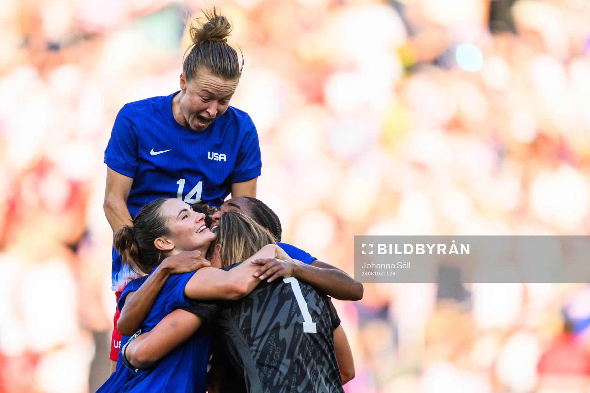 Emily Sonnett and Alyssa Naeher of USA celebrate with