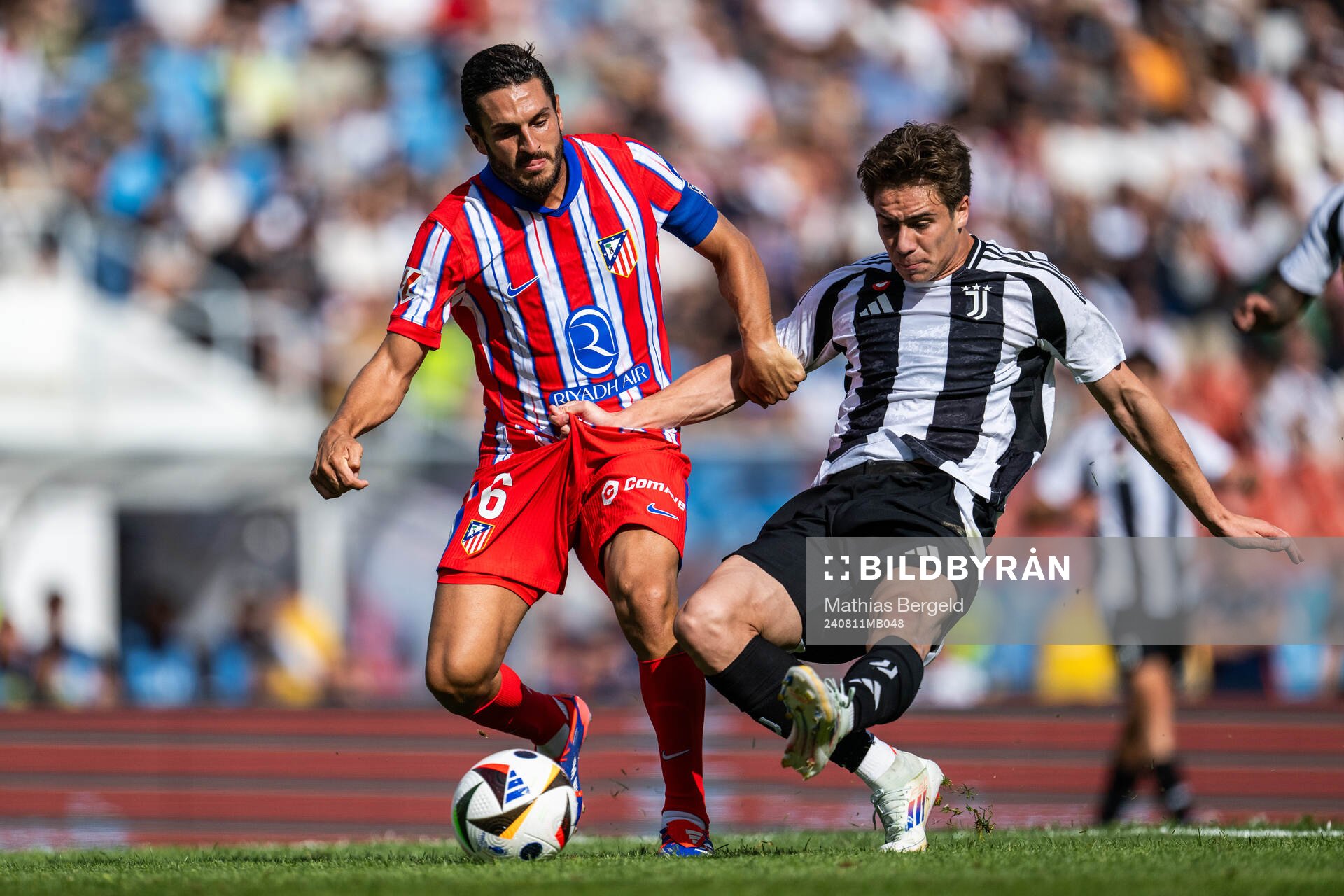 Koke of Atletico Madrid and Kenan Yildiz of Juventus