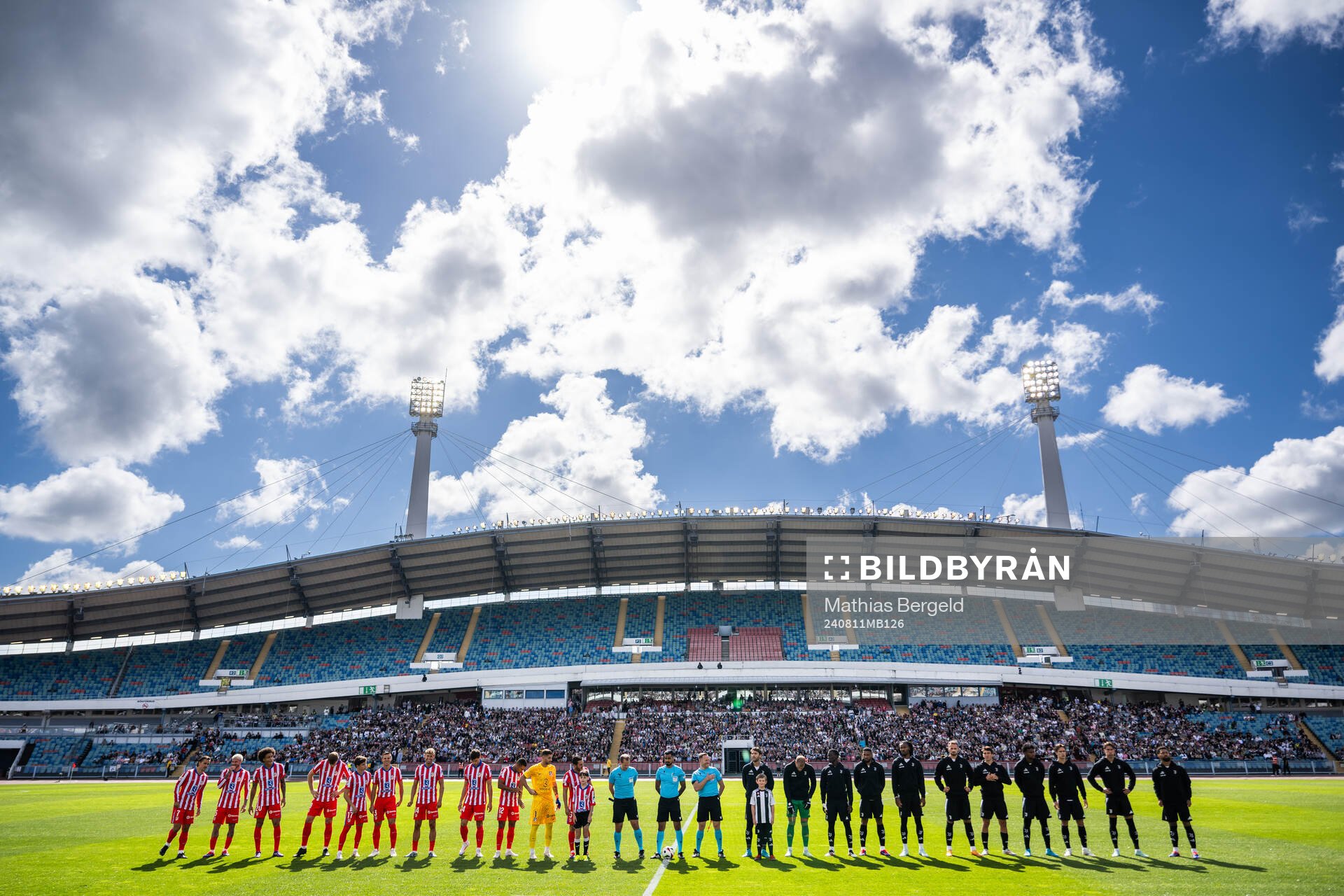 Players of Atletico Madrid and of Juventus line up